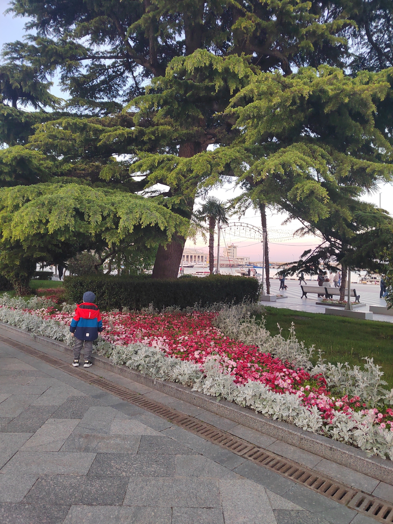 Urban waterfront promenade documented during afternoon hours May 18