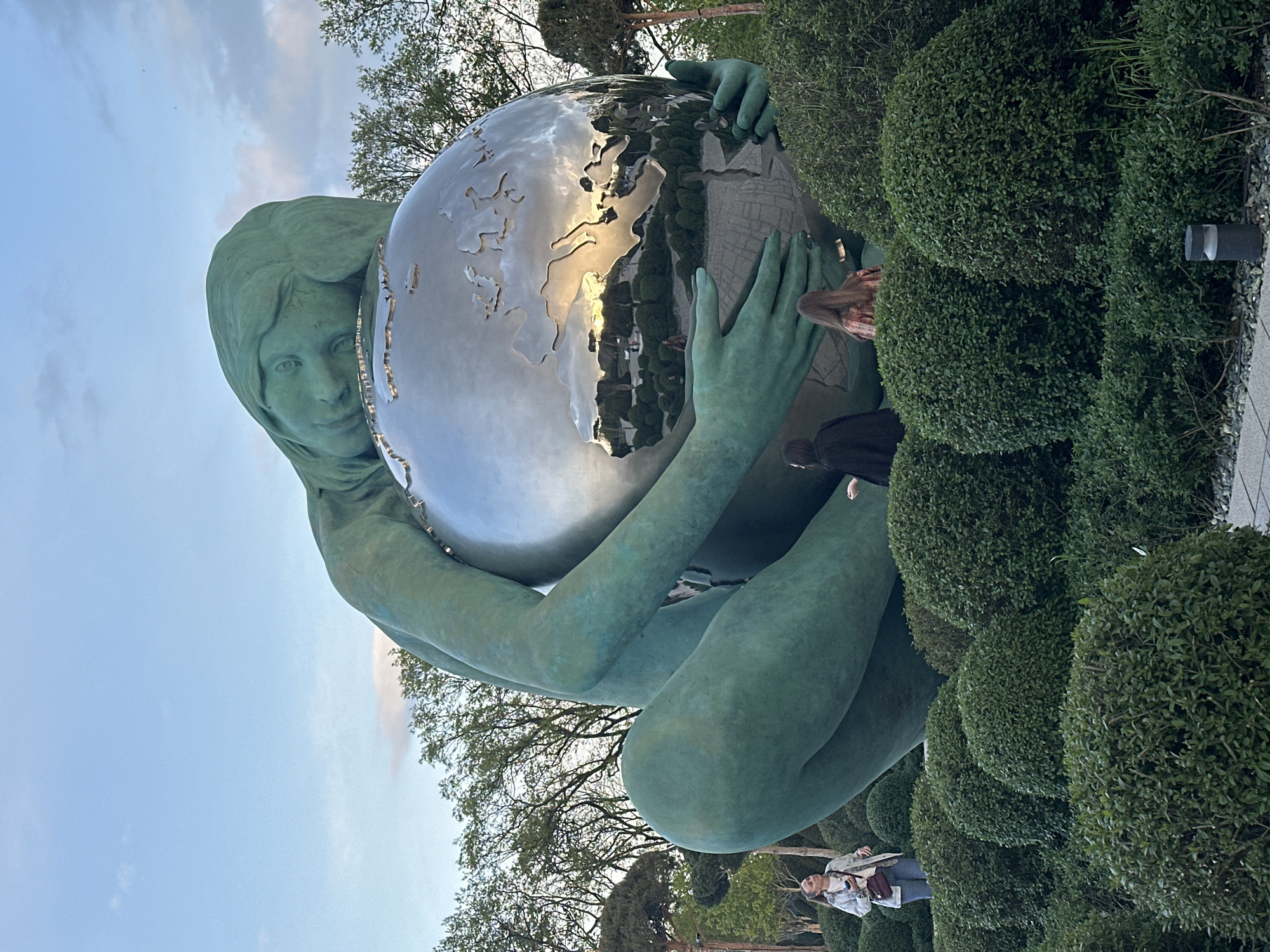 Tourist takes selfie at globe sculpture in Krasnodar park