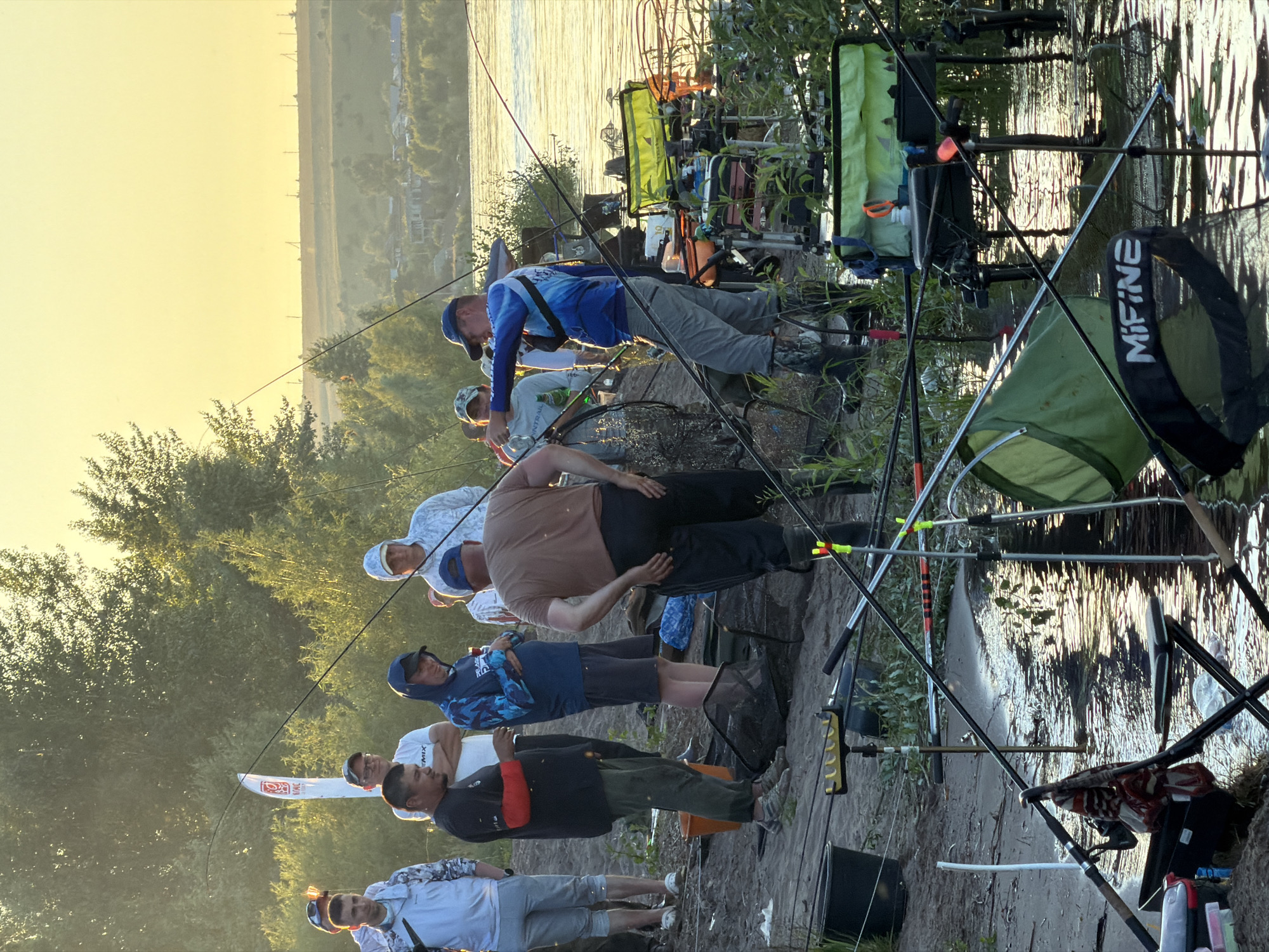 Riverside fishing gathering near Tarasovo at golden hour