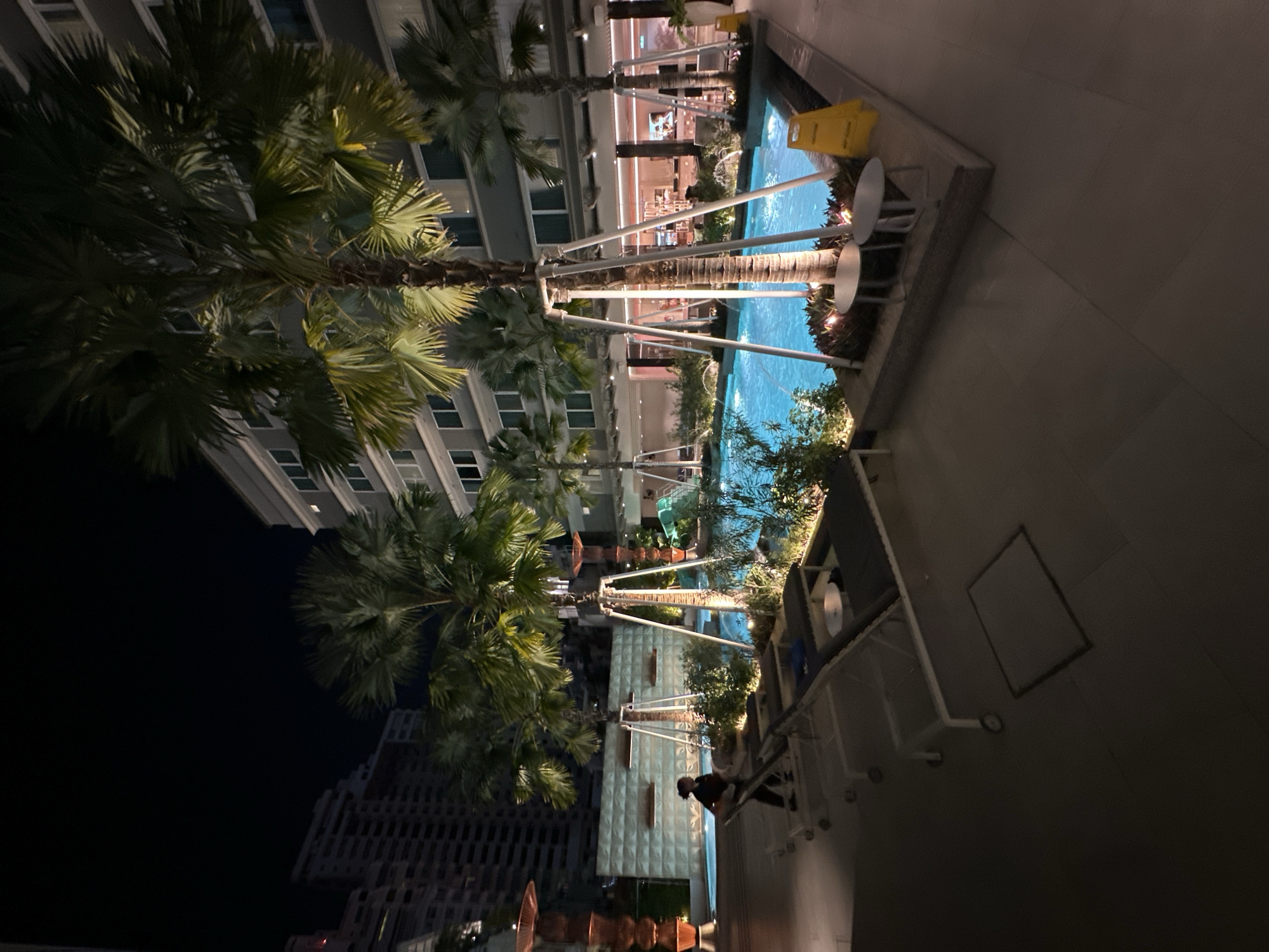 Bangkok nighttime scenes show heavy traffic, illuminated pool area