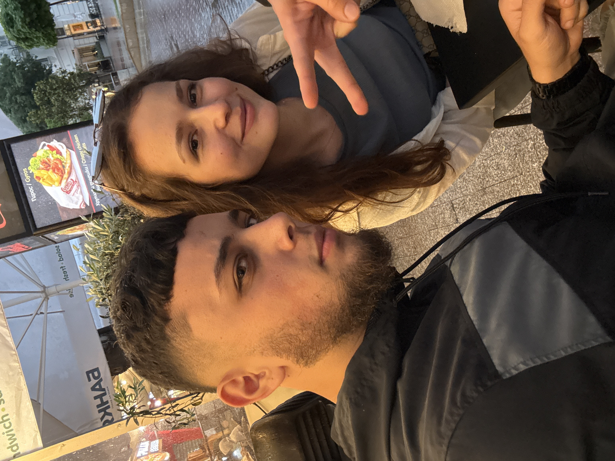 Young adults share evening street food meal in Varna