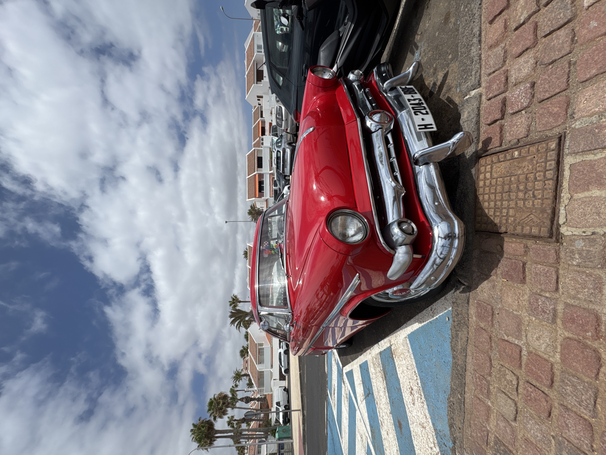 Surf, sand, and a vintage Ford on the Arona coast
