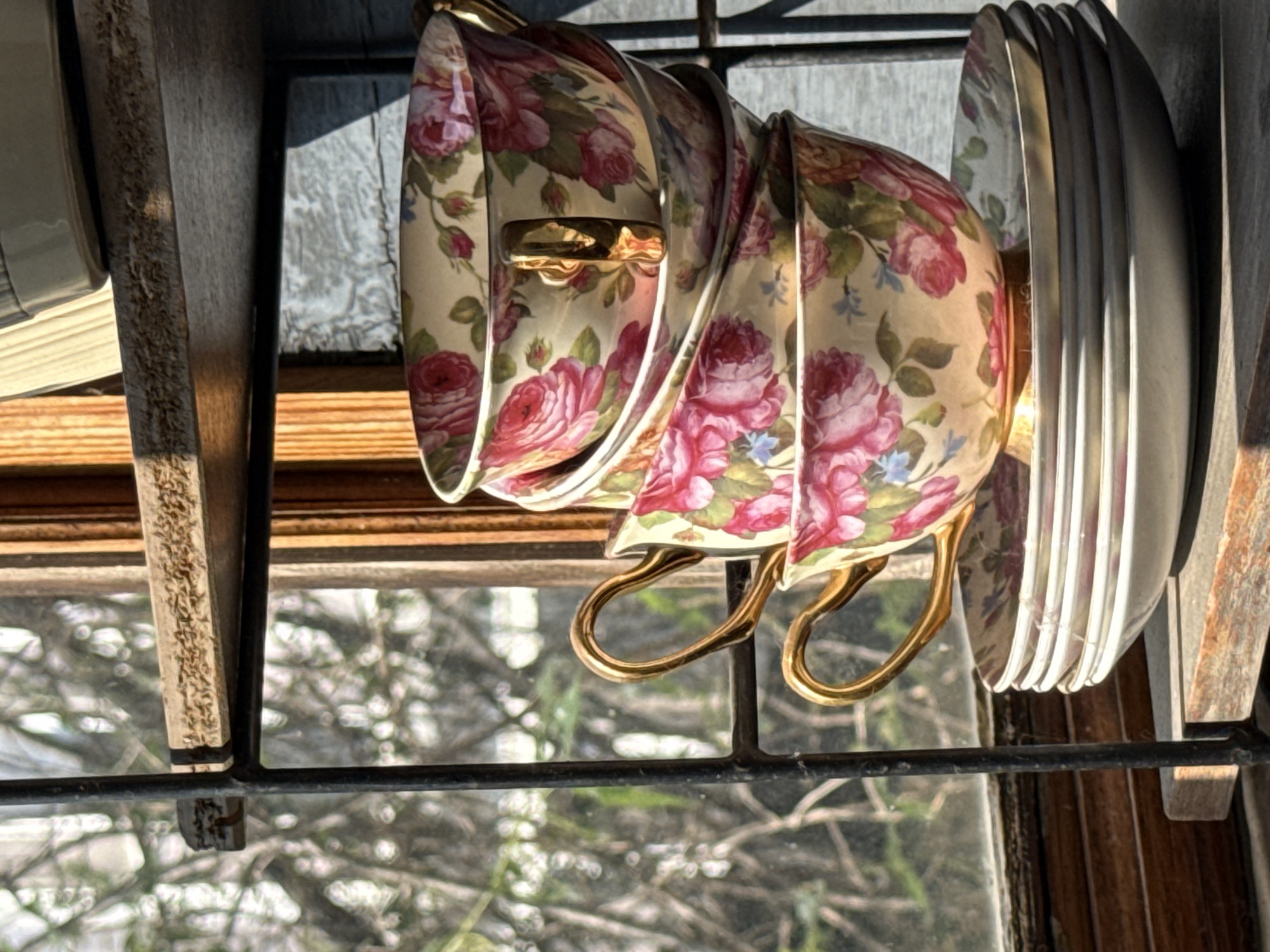 Floral teacups stacked on a shelf in Lobacheve