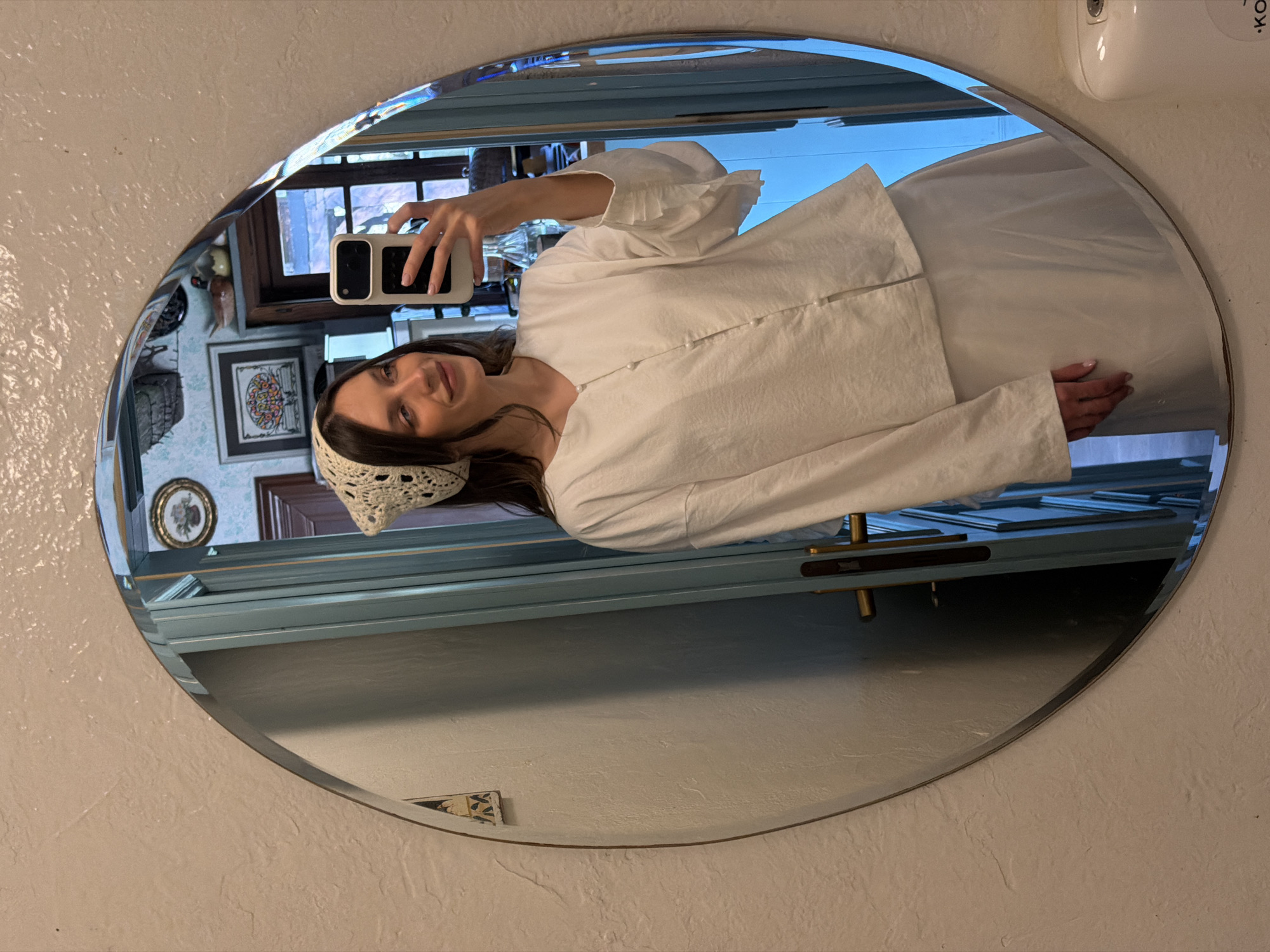 Woman Takes Mirror Selfie in White Outfit, Serbia