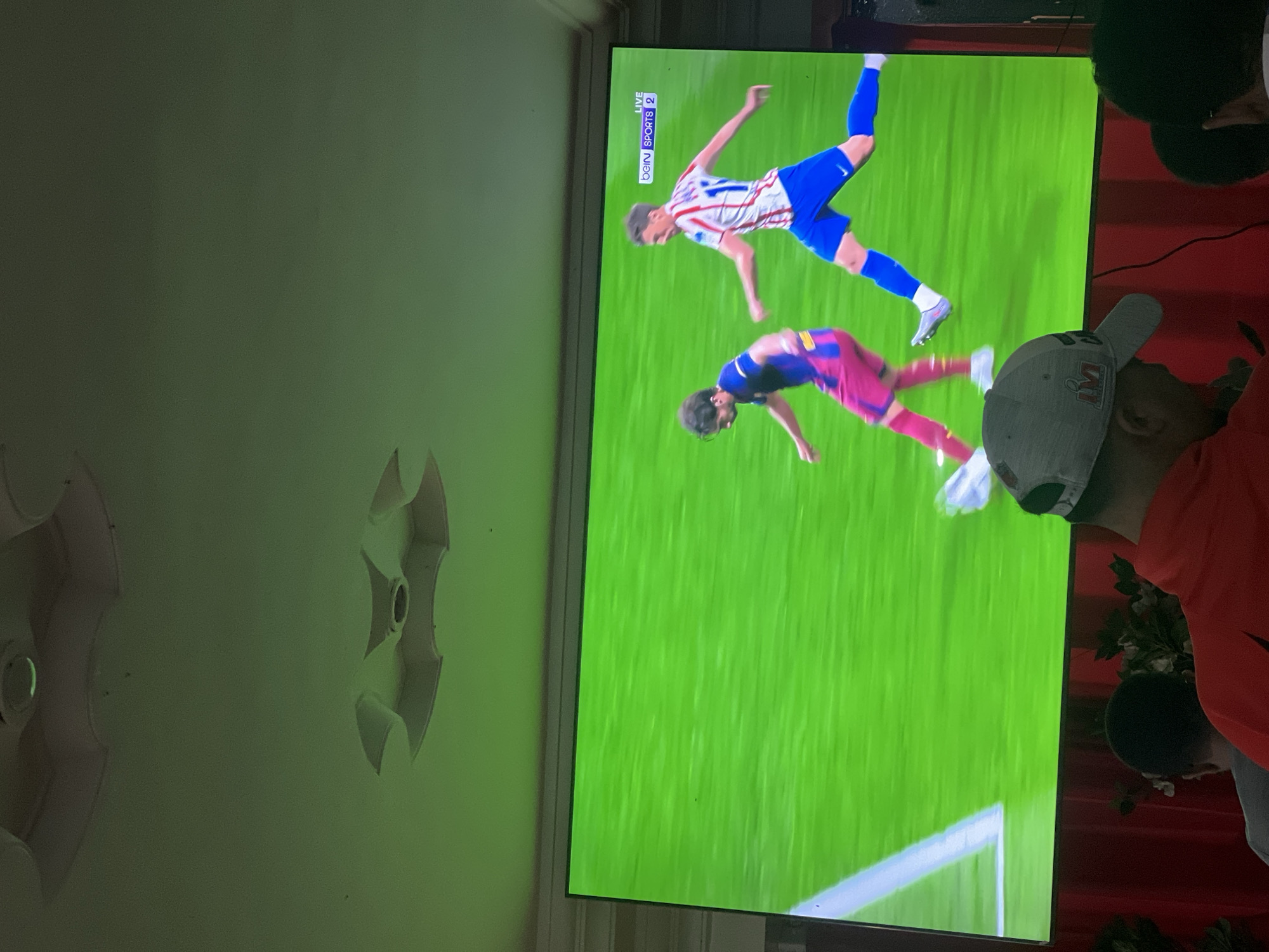 Evening leisure time: soccer viewing and pool game in Morocco