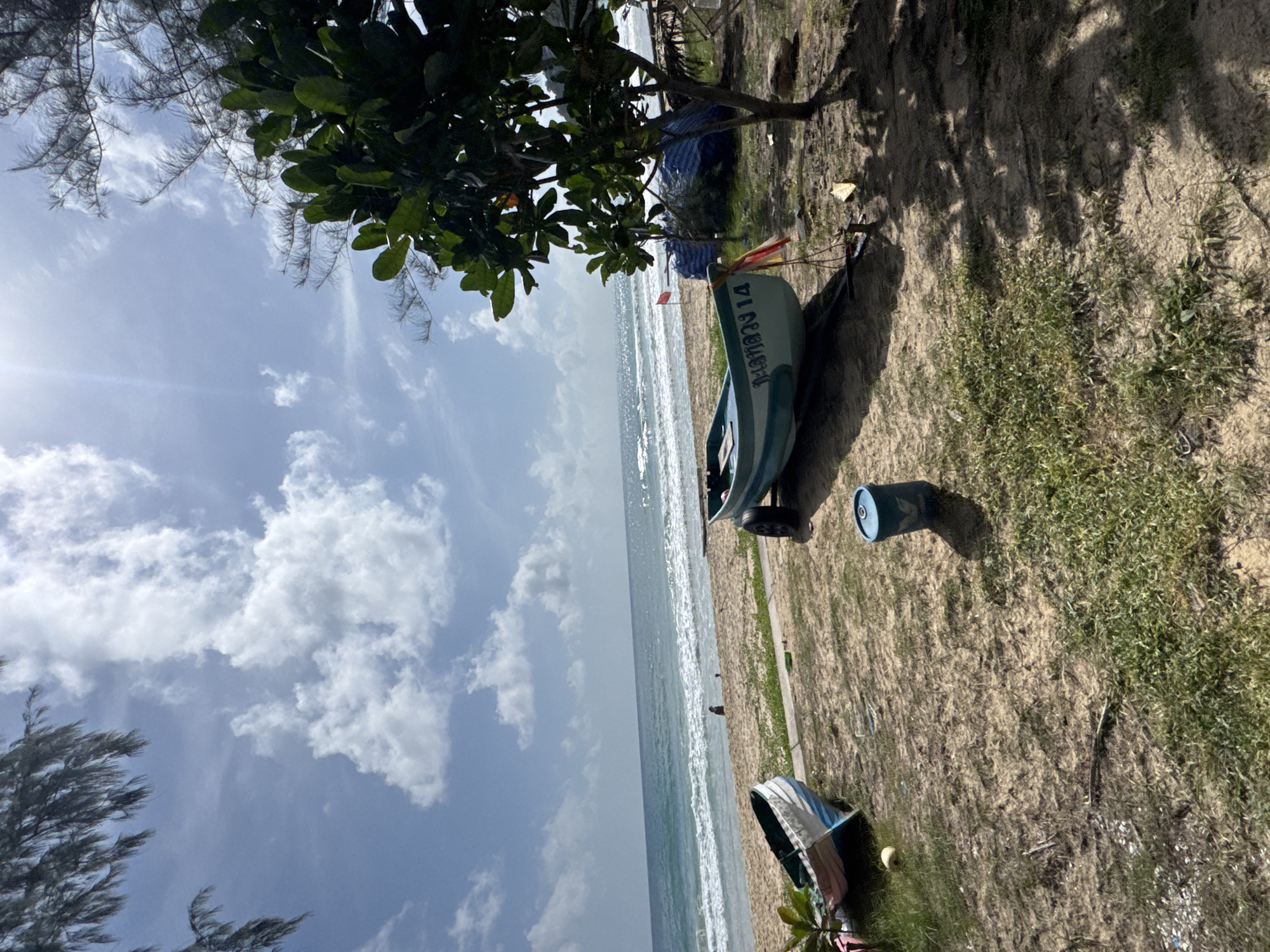 Karon Beach morning: parasailing, shoreline activity, and calm surf