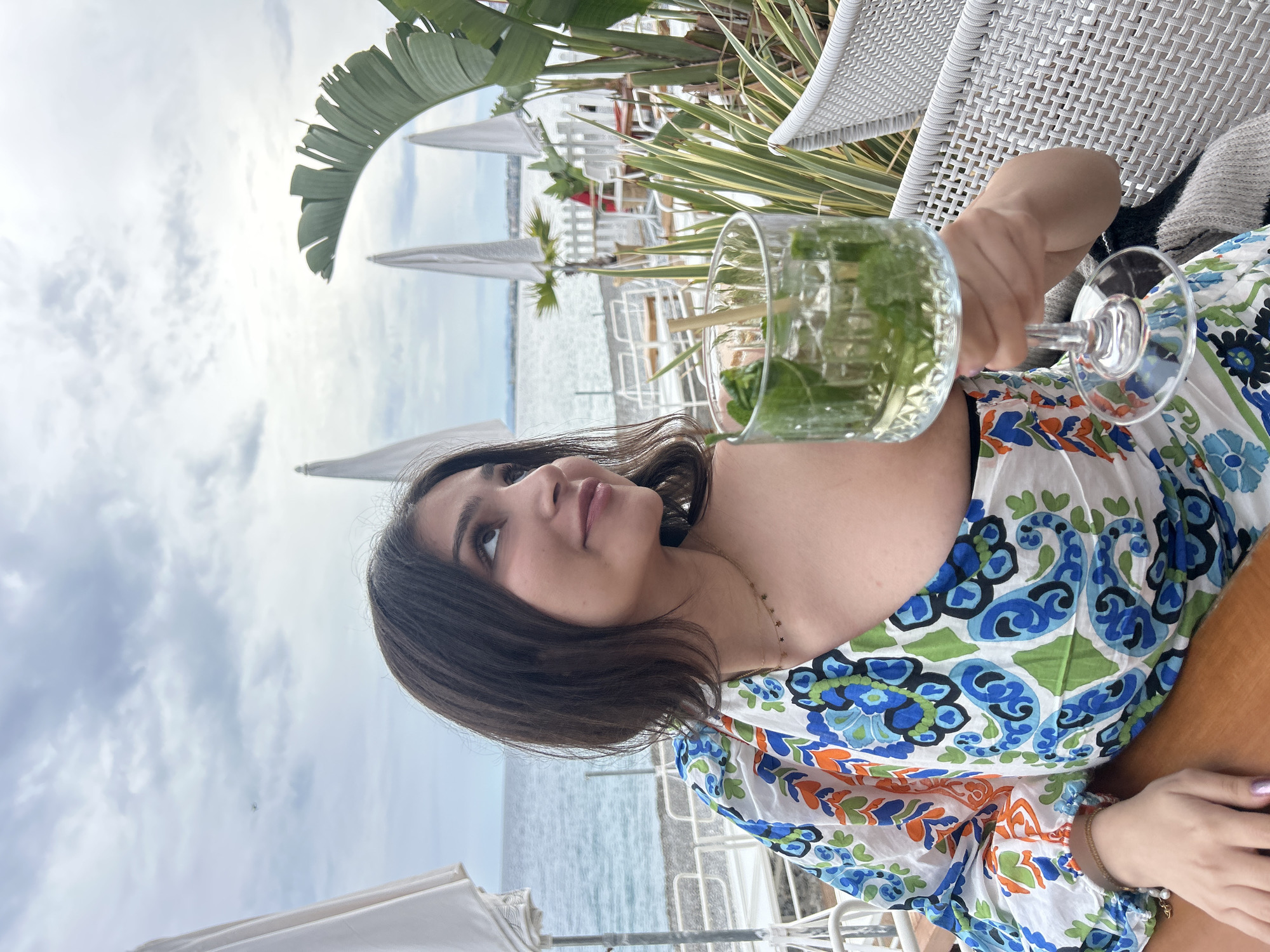 Cloudy afternoon captures cafe moment and beach scene in Nice