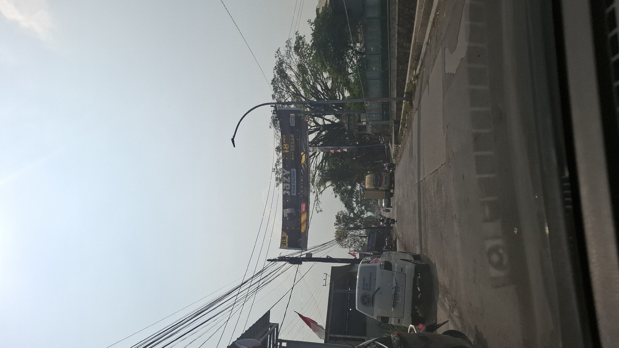 Morning drive through West Java with Indonesian flags out