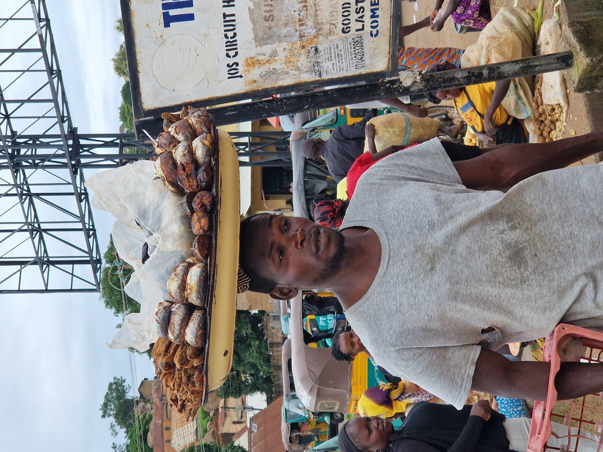 Street market hustle with head-carried goods and everyday movement