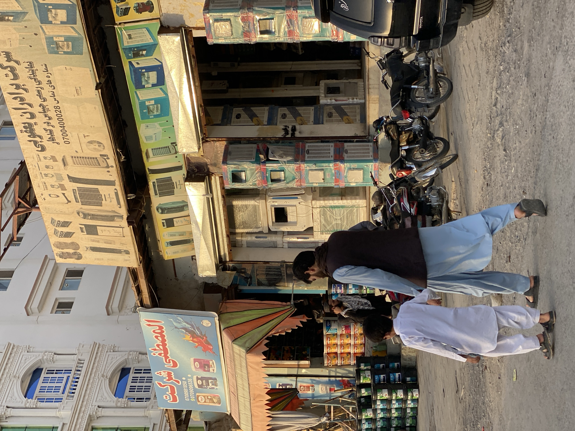 Air coolers stacked for sale on a Kandahar street