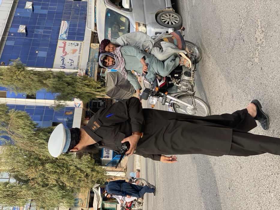 Traffic officer directs intersection in Kandahar, Afghanistan