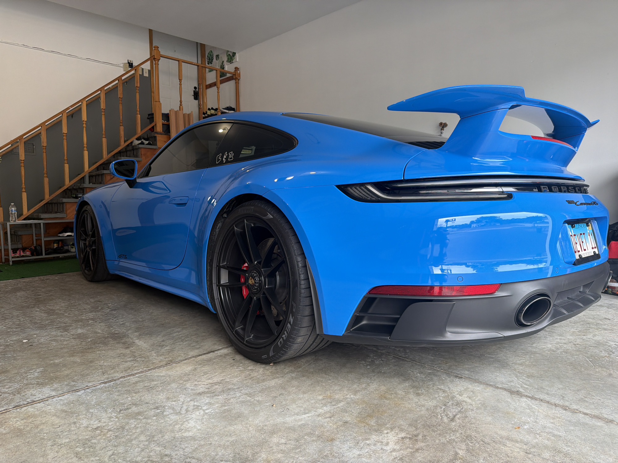 Blue Porsche 911 GTS detailed in a Wisconsin Dells garage