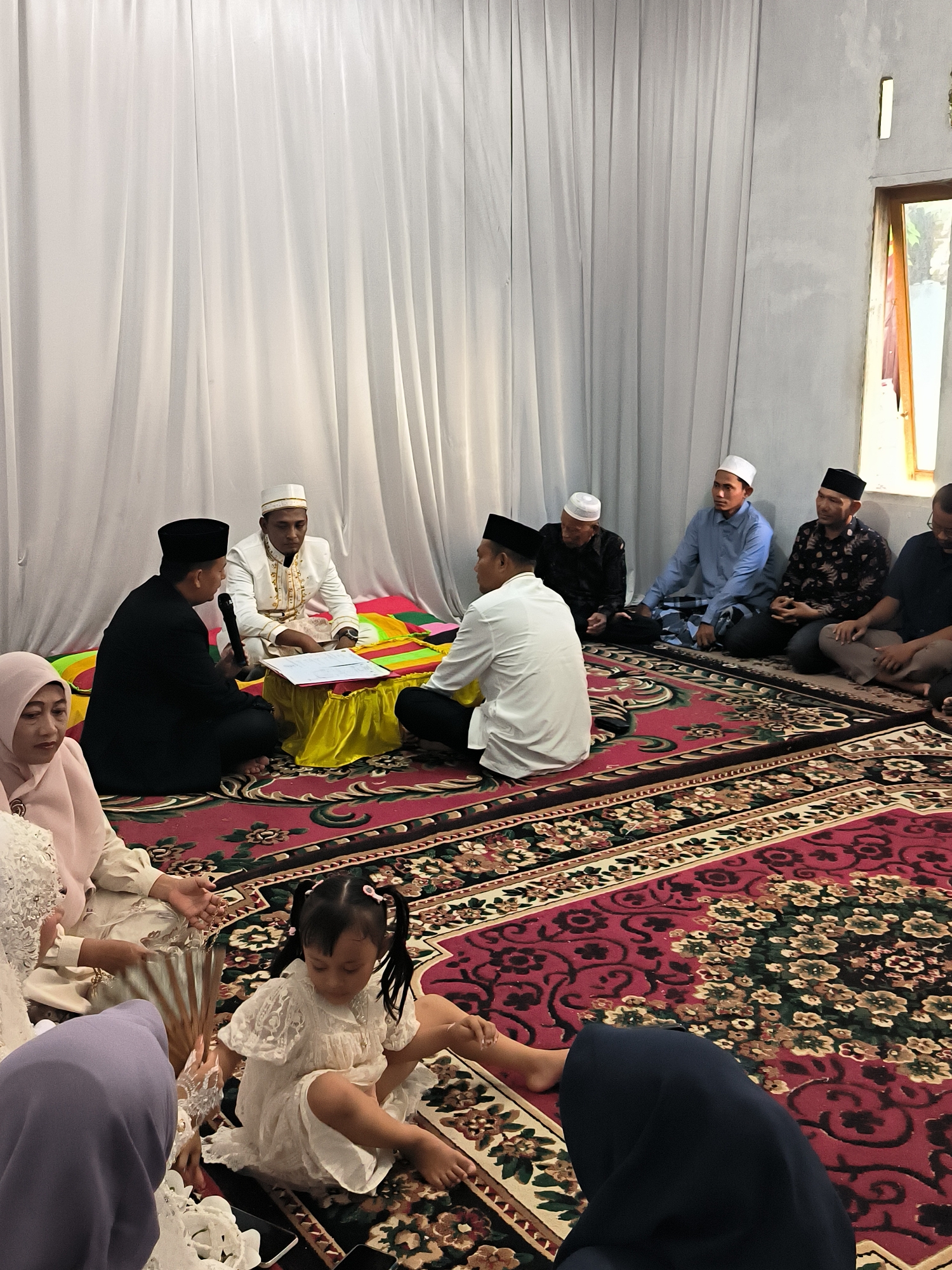 Traditional wedding ceremony underway in Lhokseumawe, Indonesia