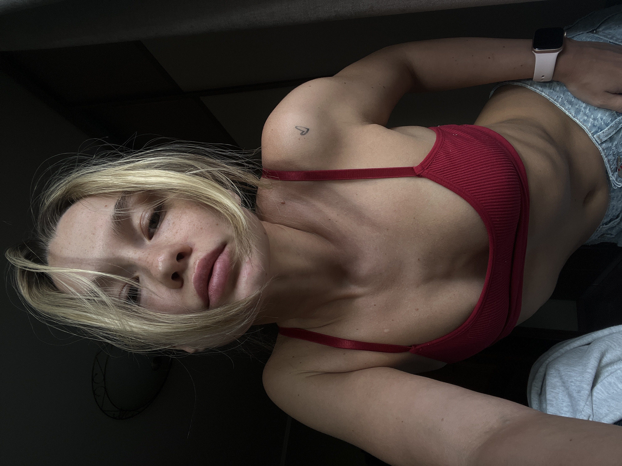Woman takes selfies in Voronezh building during afternoon
