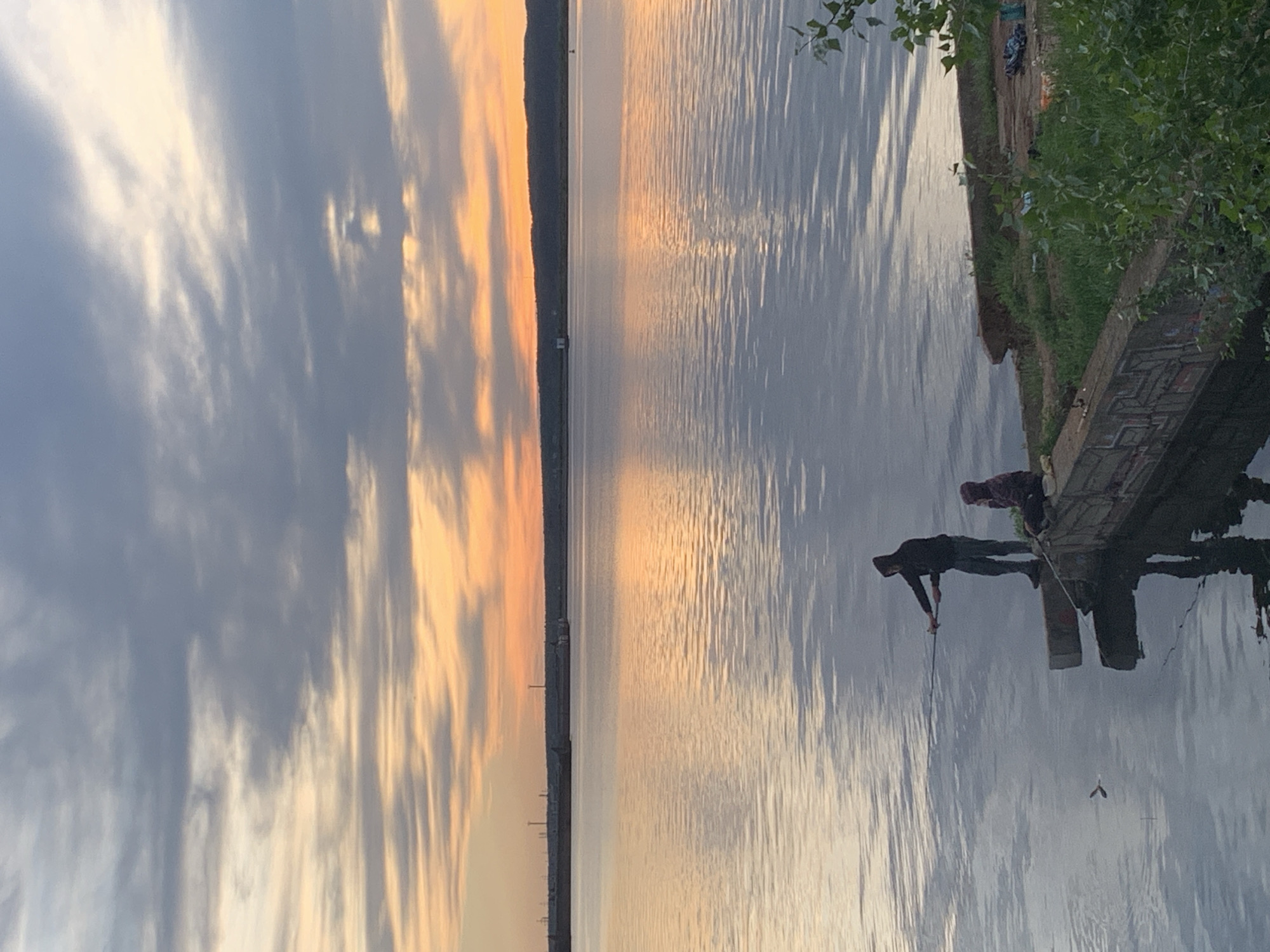 Leisure activities observed at Chaikovsky waterfront during sunset