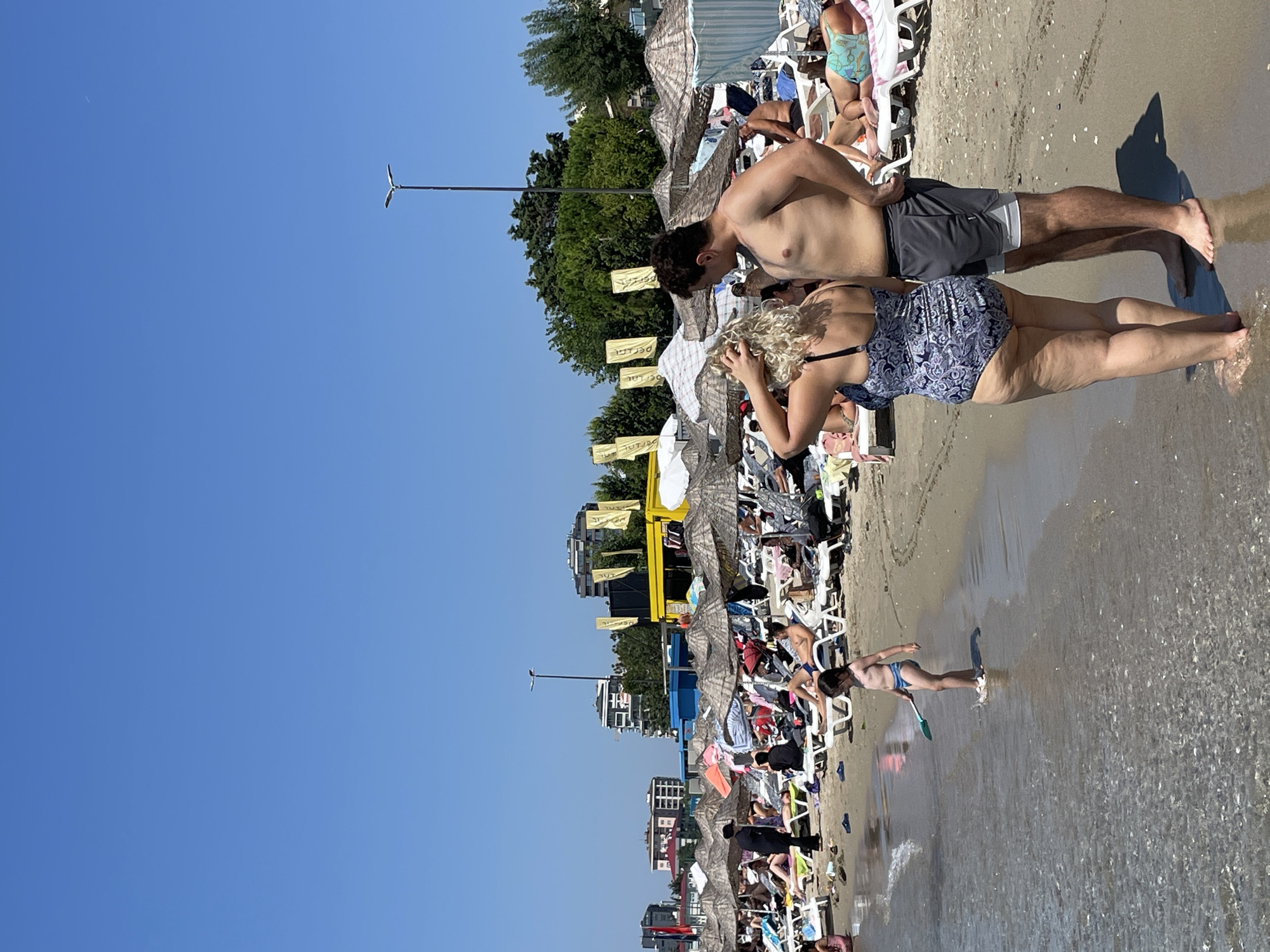 Summer morning in Kadıköy: beach crowds, neighborhood streets, Hello Kitty scooter