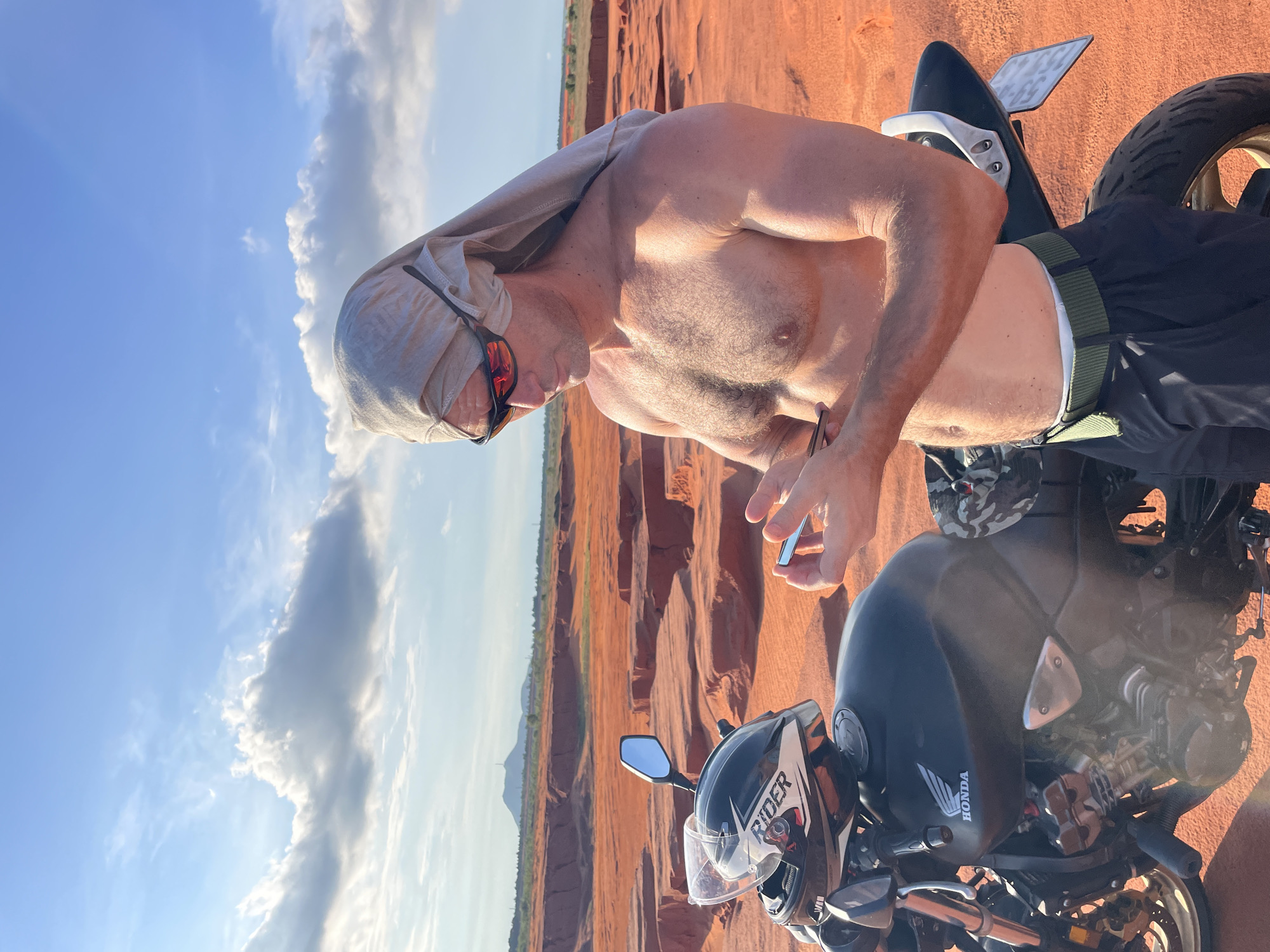 Motorcyclist explores Mui Ne red sand dunes, Vietnam