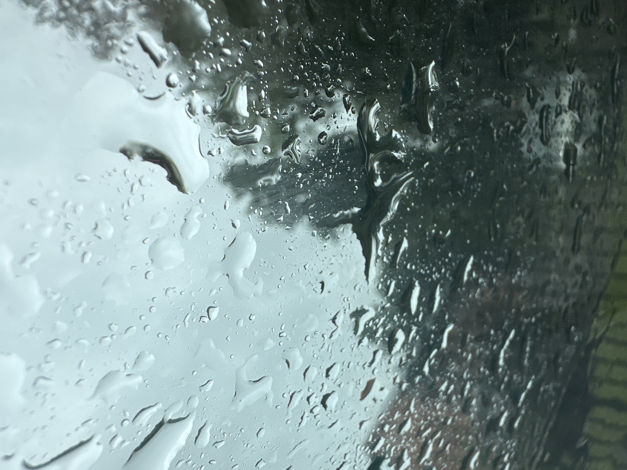Rainy morning in Monastyrshchina, viewed from inside a car