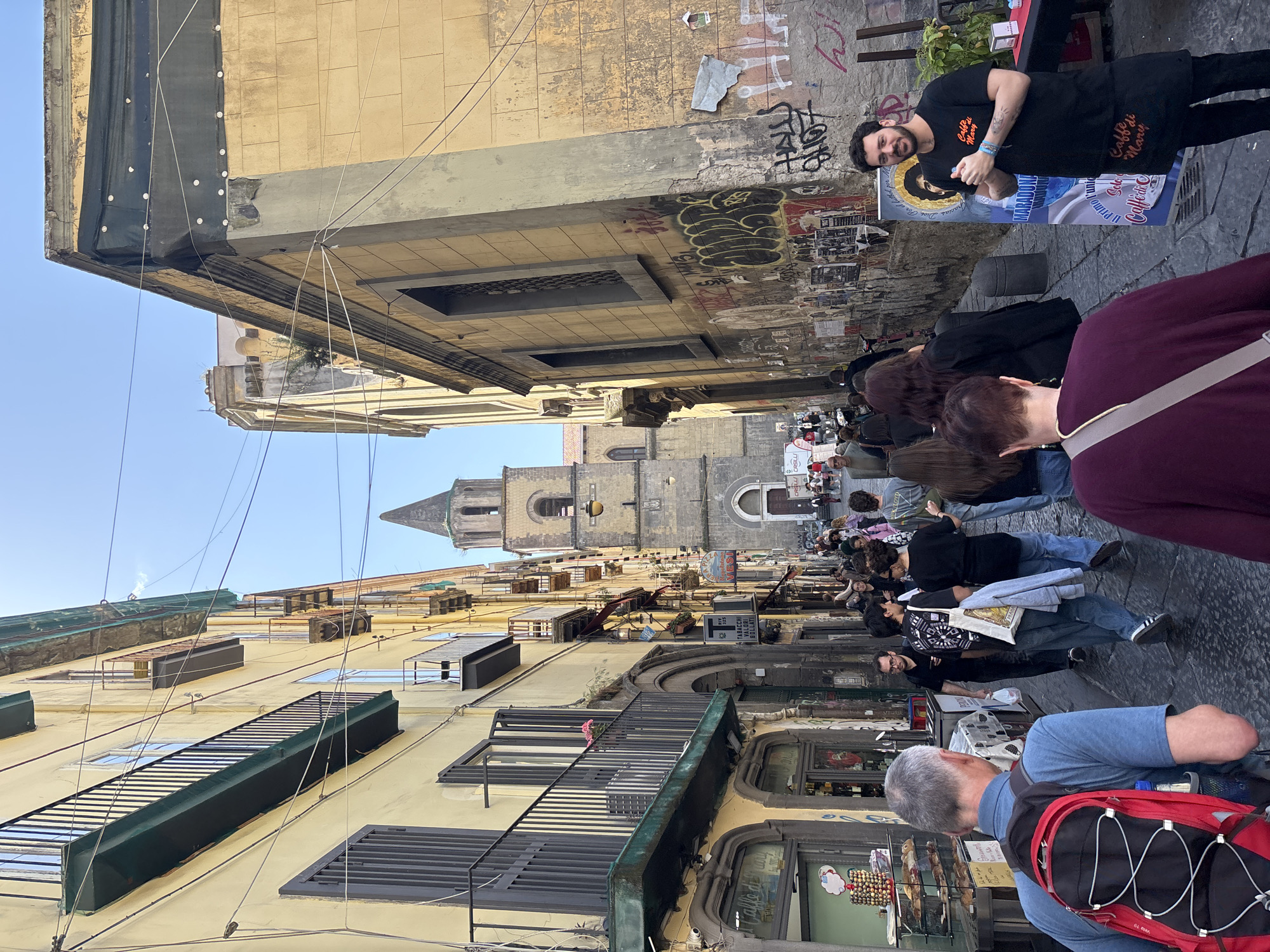 Naples street life and cuisine documented during midday hours
