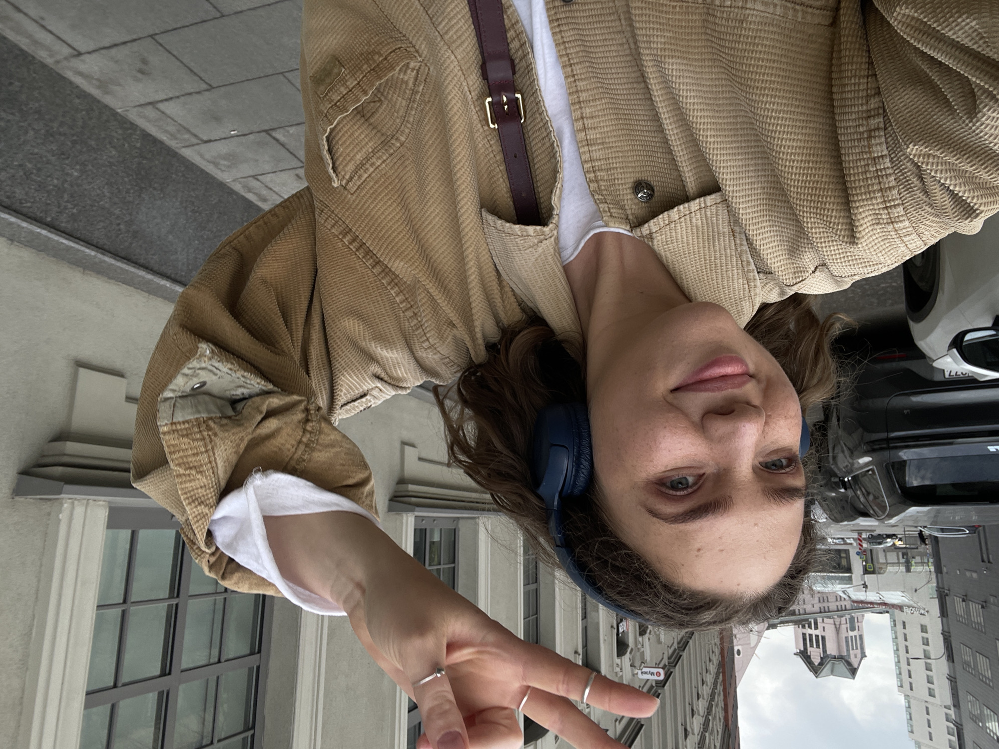 Young woman takes street selfies in Moscow's Zamoskvorechye district