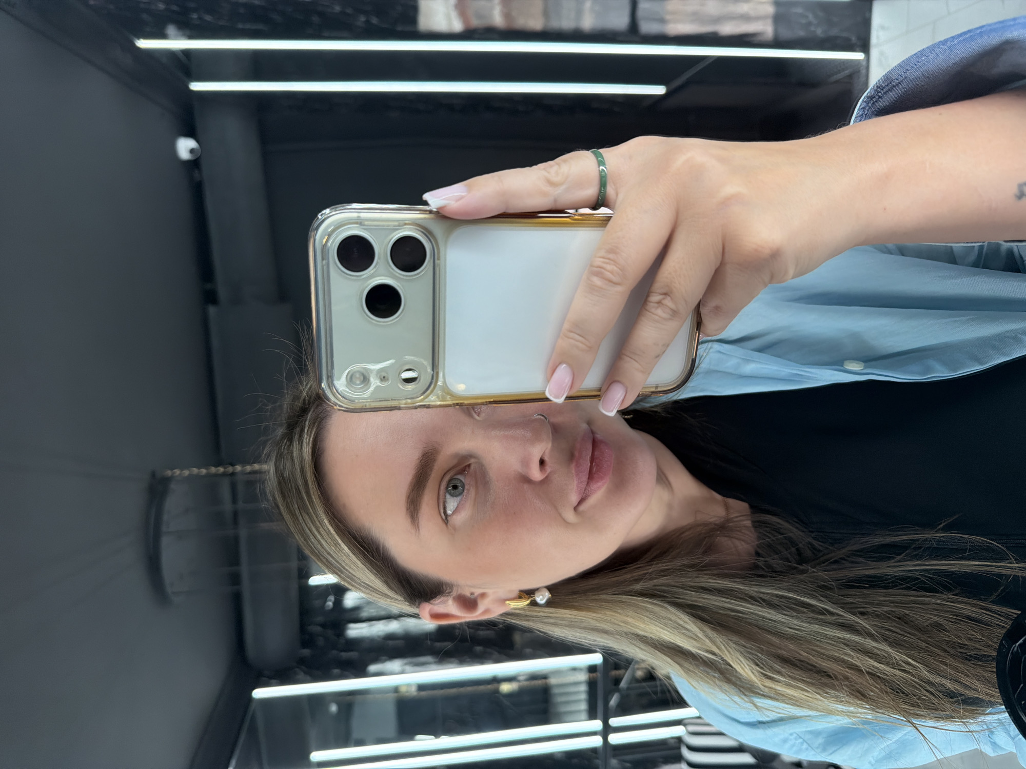 Woman takes selfie with decorated tumbler in Moscow