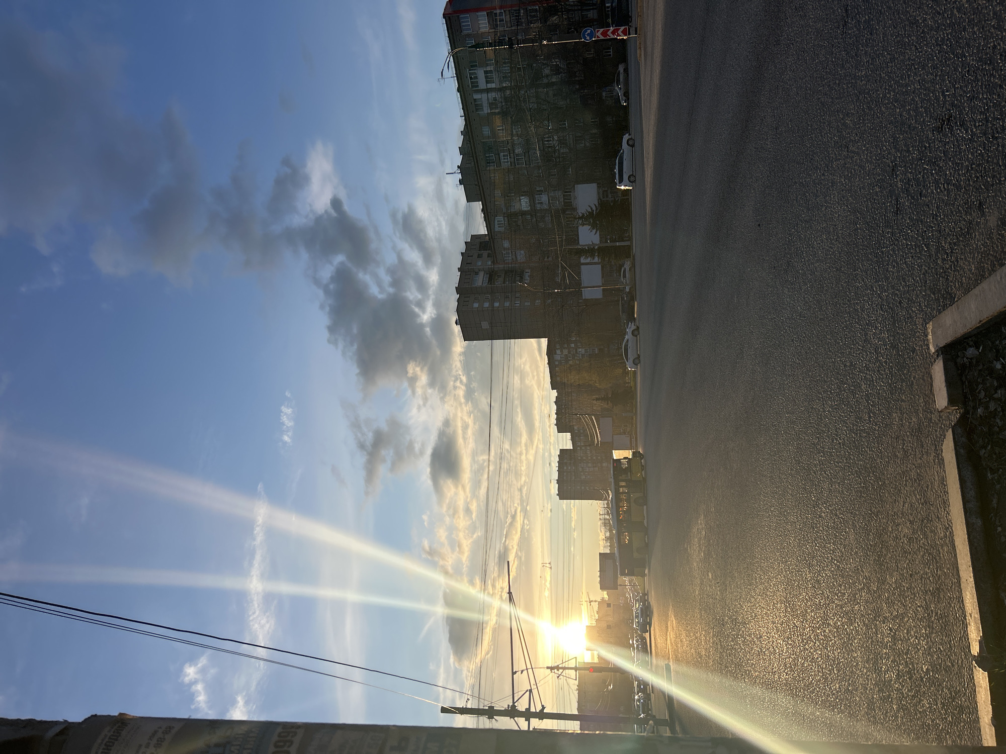 Golden hour sunset illuminates Izhevsk street scene