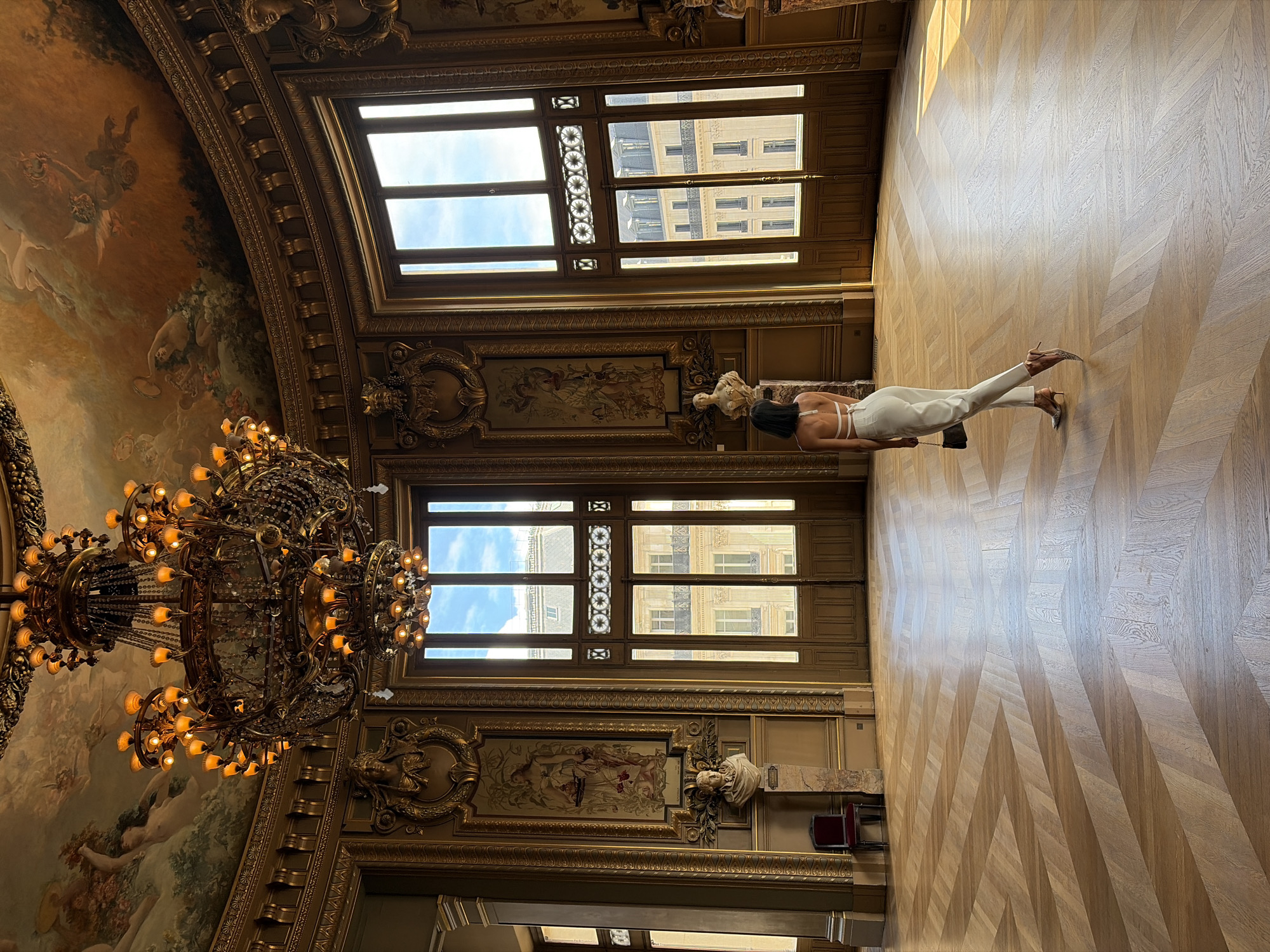 Visitors explore Palais Garnier opera house and Parisian rooftops