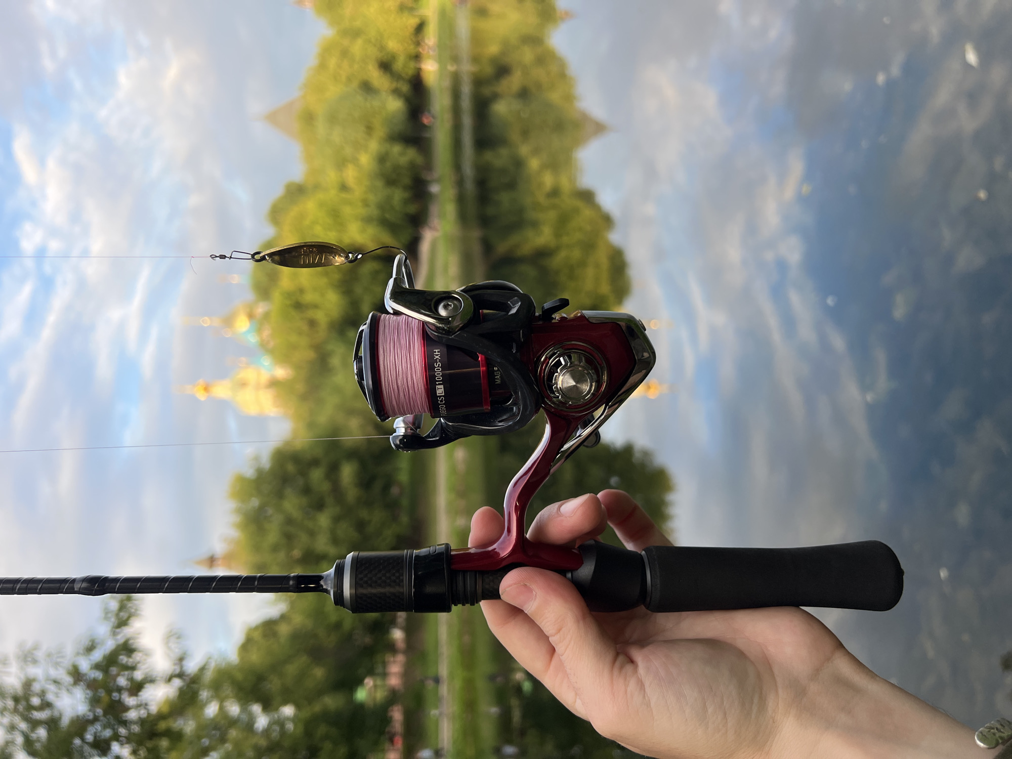 Gold lure and pink line on a fishing rod in Moscow