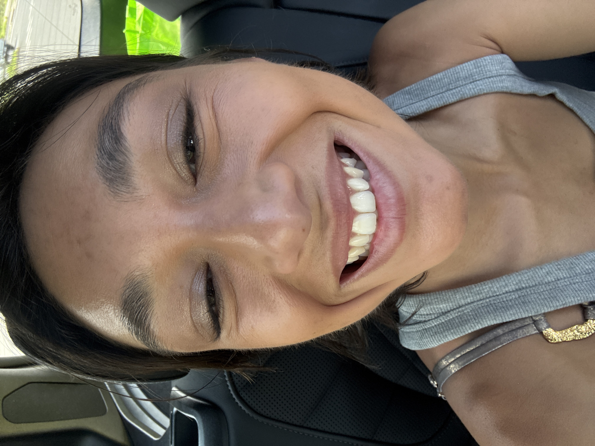 Woman captures cheerful selfie moment in Kailua