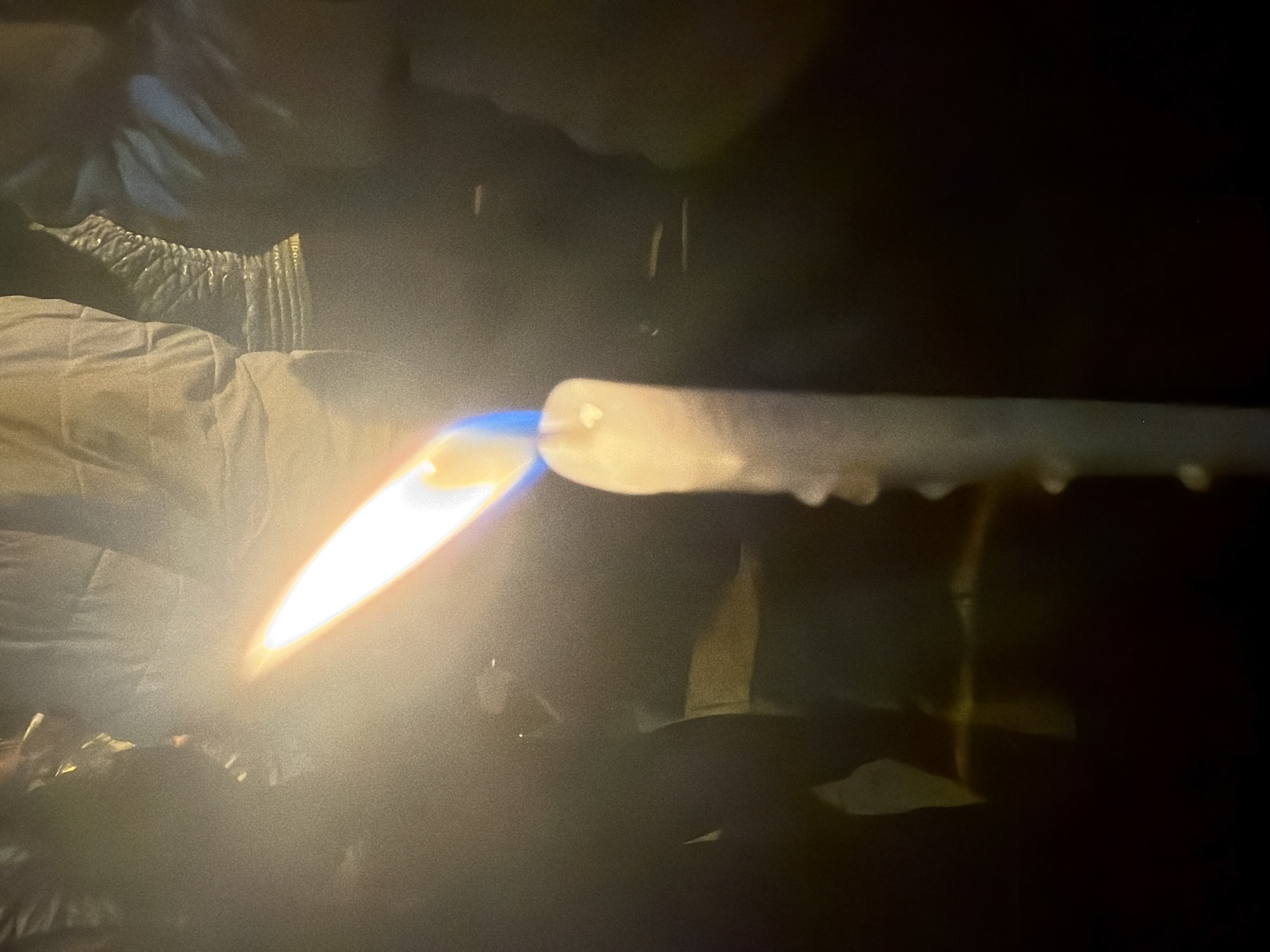 Person uses torch to heat glass object in Sofia