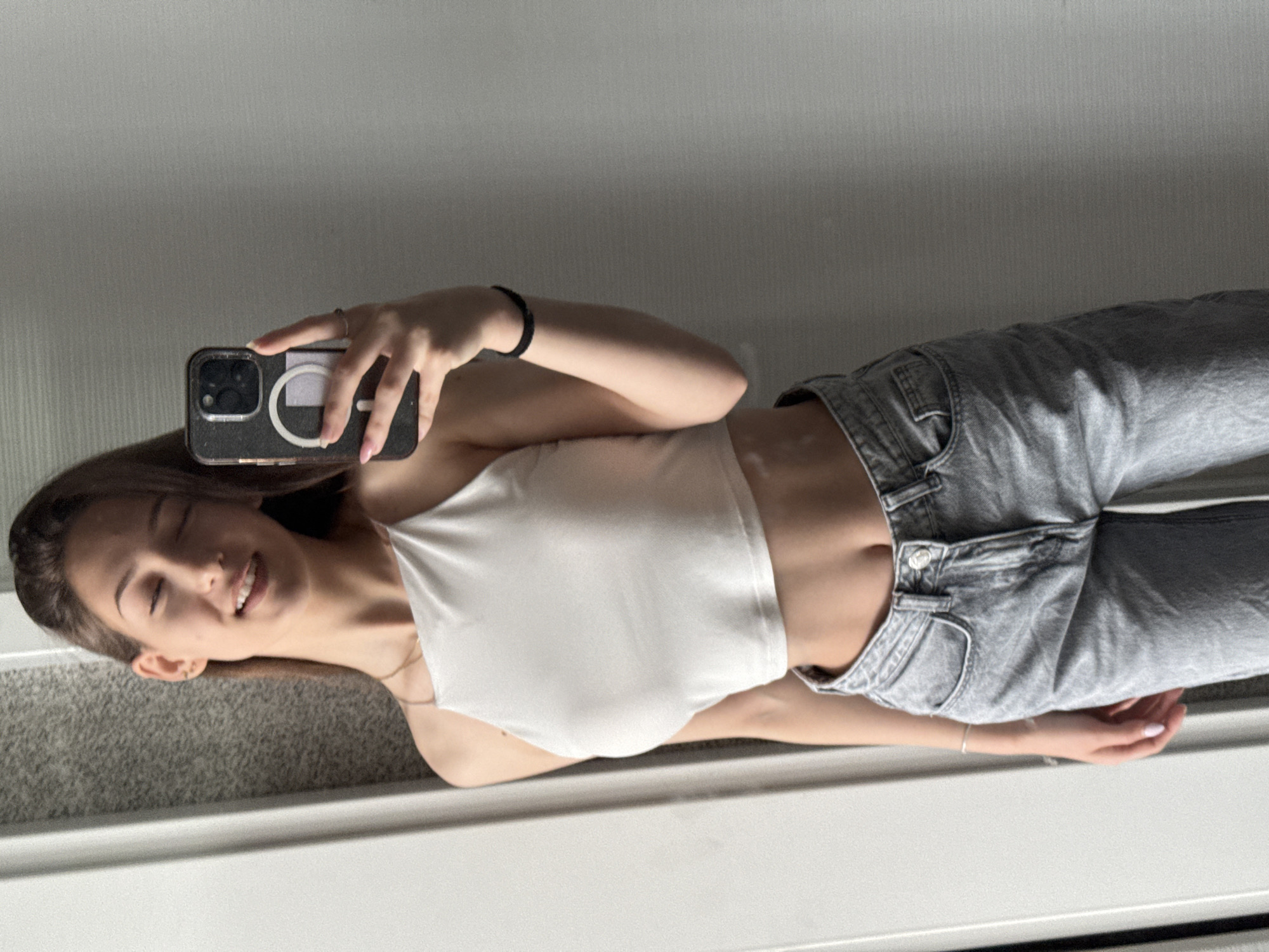 Woman takes multiple mirror selfies during morning session in Sofia