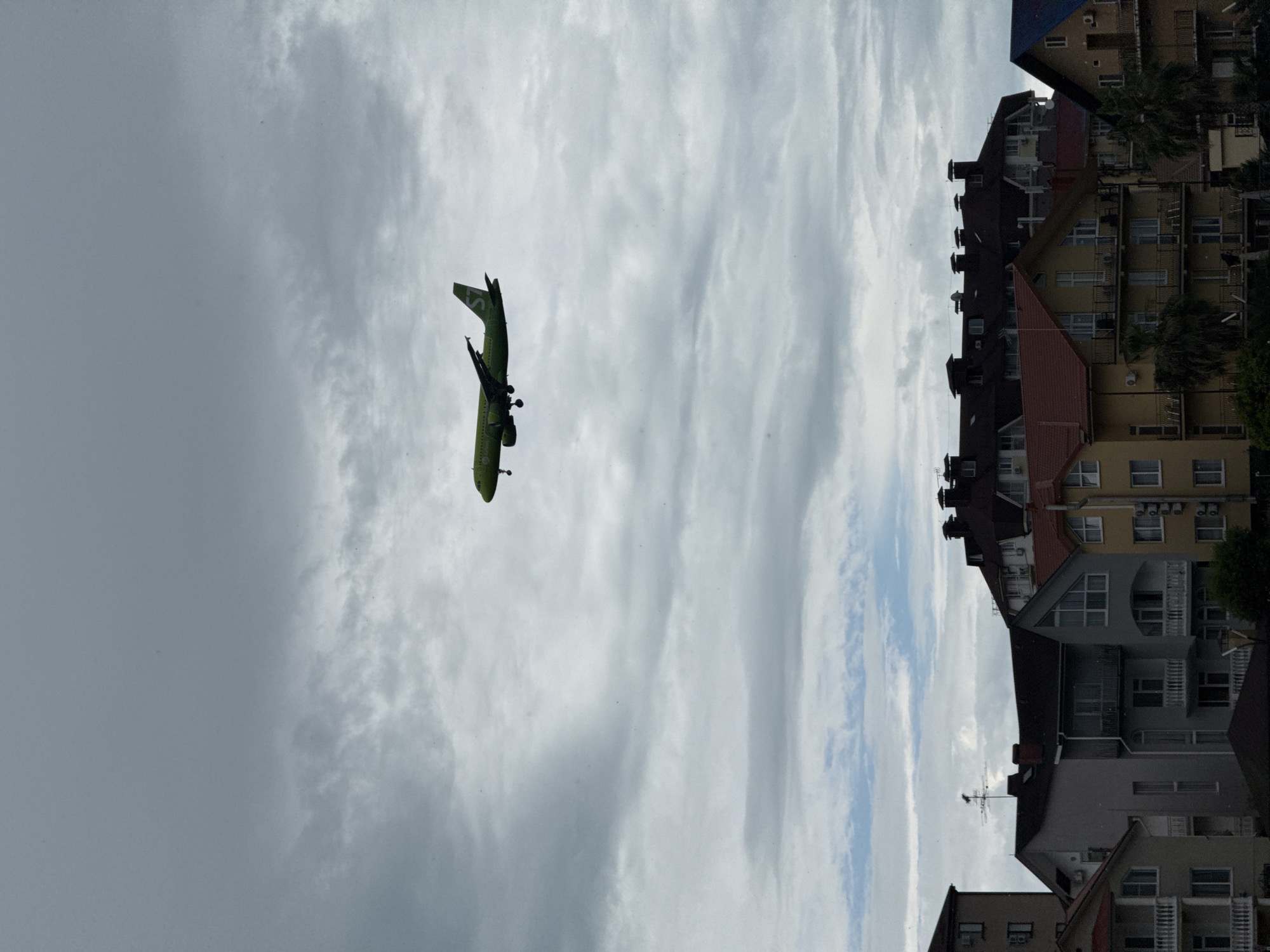 S7 Airlines flight observed over overcast Sochi during morning