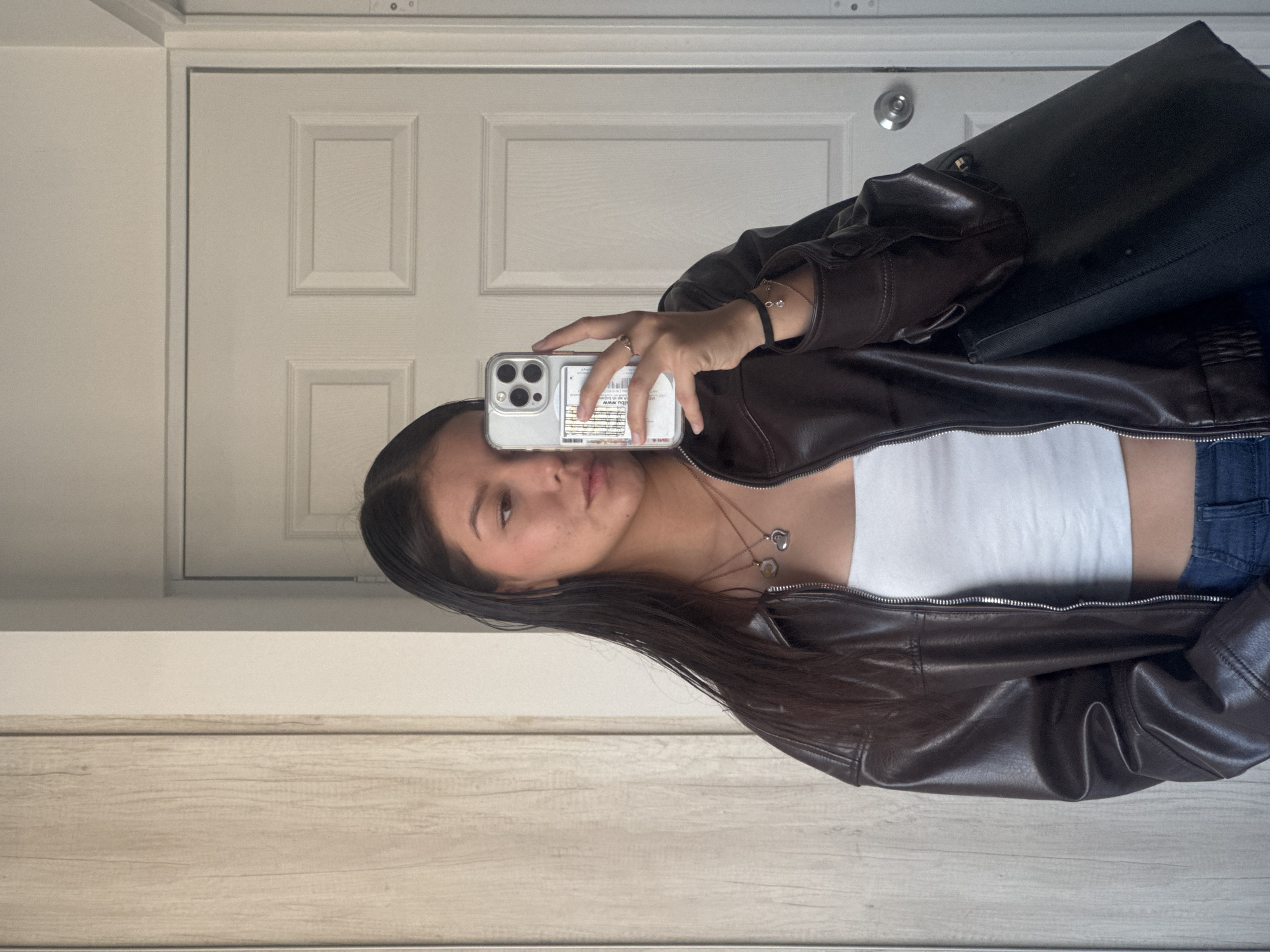 Young woman takes mirror selfies in Ocotlán, Mexico