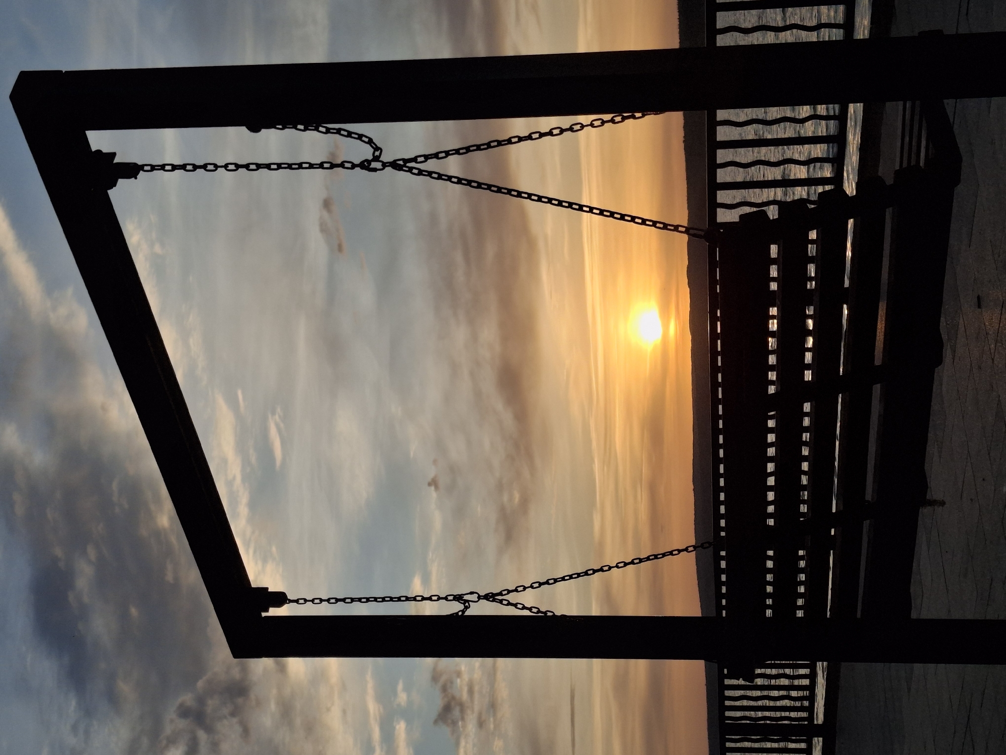 Woman enjoys sunset swing moment in Chaikovsky, Russia