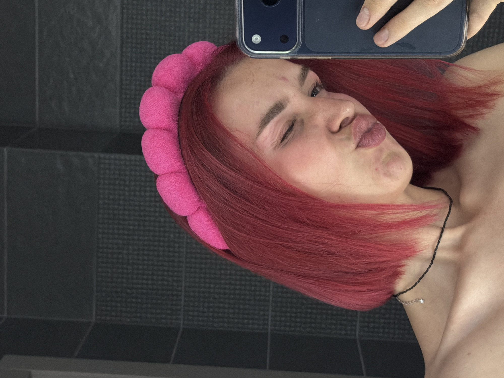 Pink-haired person photographed multiple times in Chaikovsky, Russia