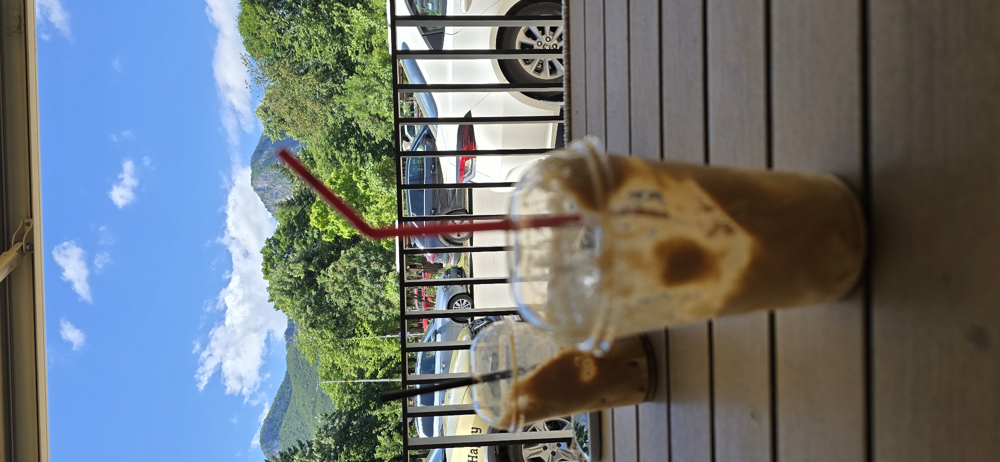 Coffee break at outdoor cafe with mountain street view