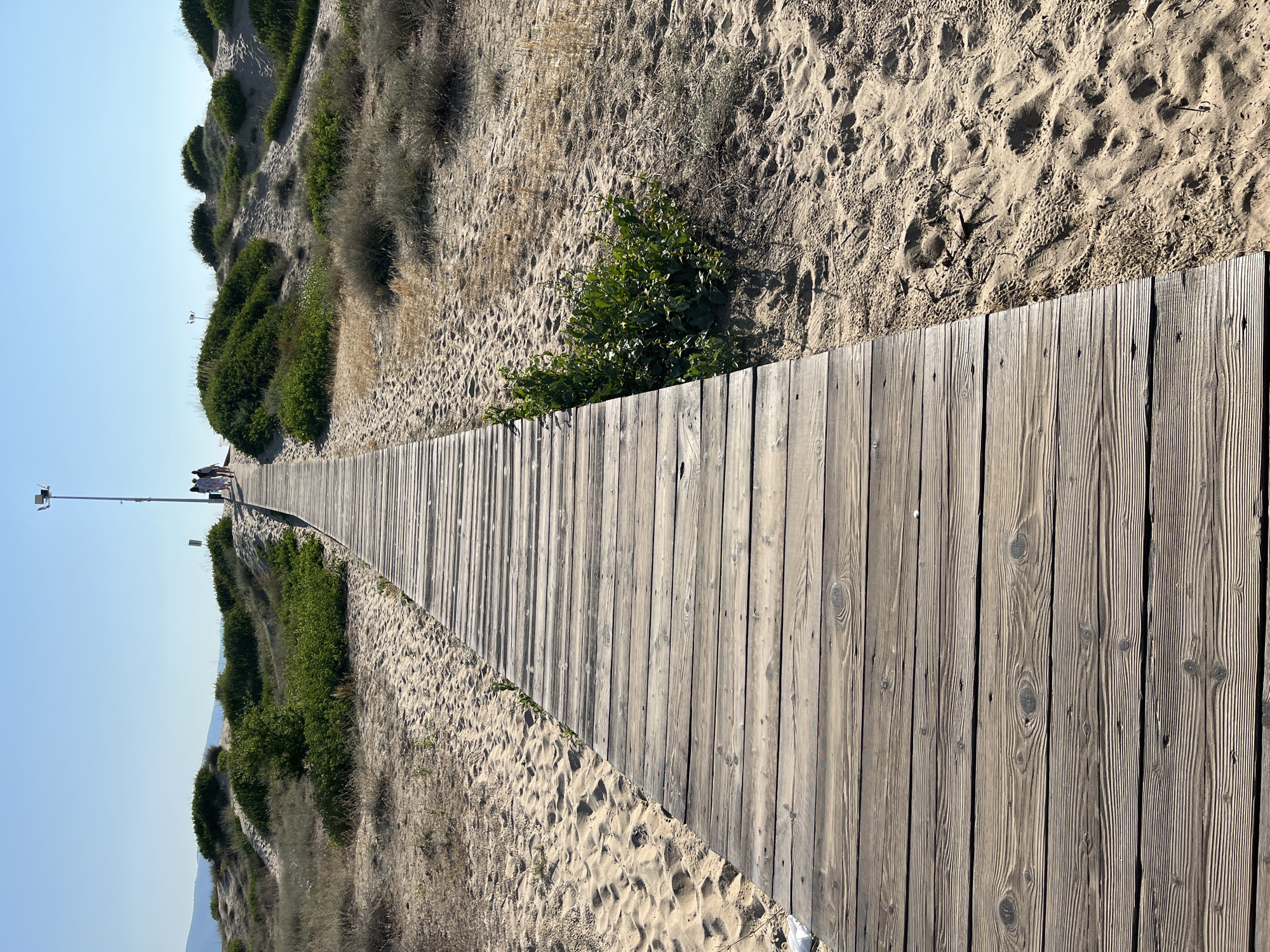 Sandy beach and boardwalk scene along the Nesebar coastline