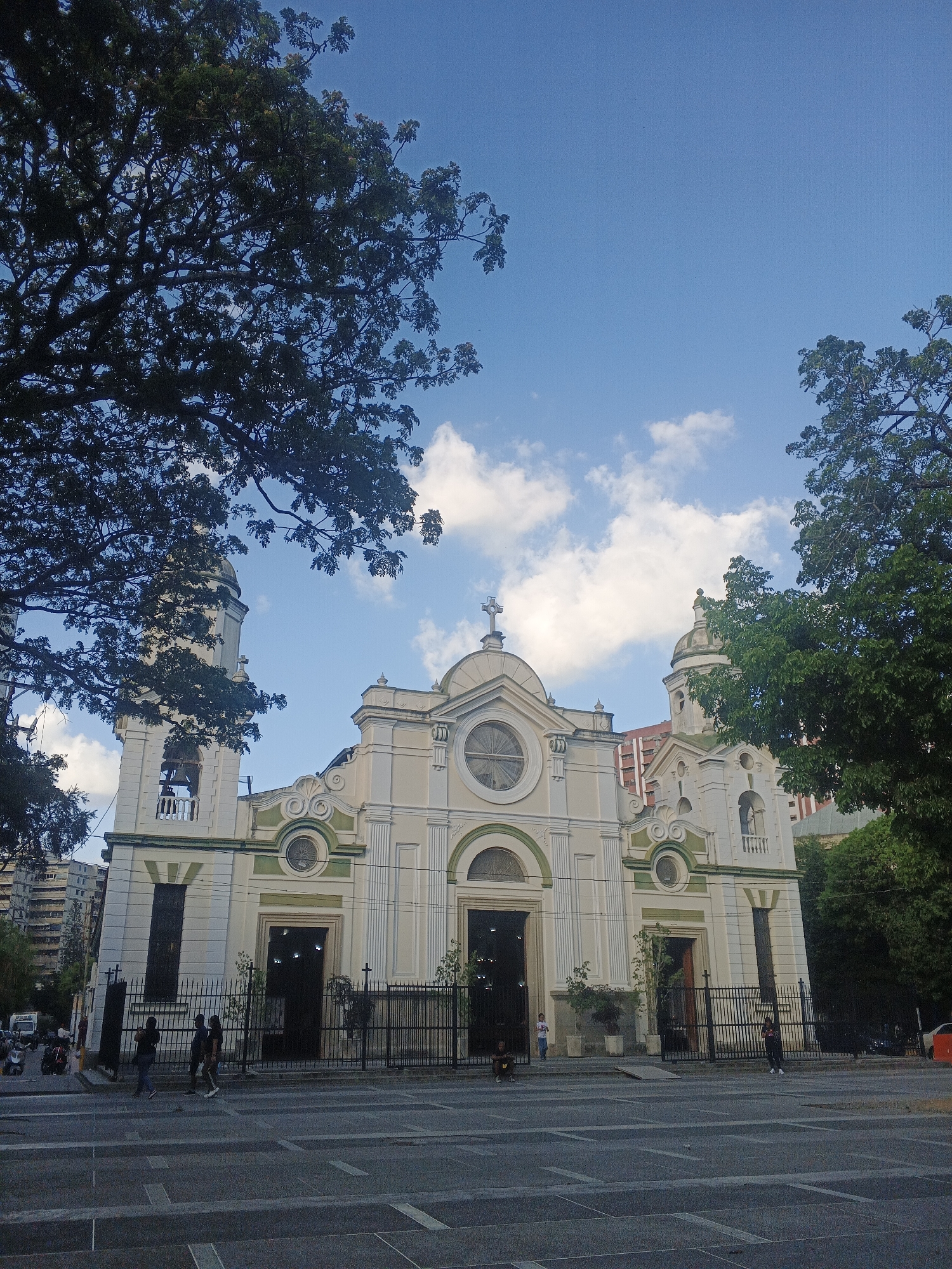 Evening street life documented around Santa Teresa Basilica, Caracas