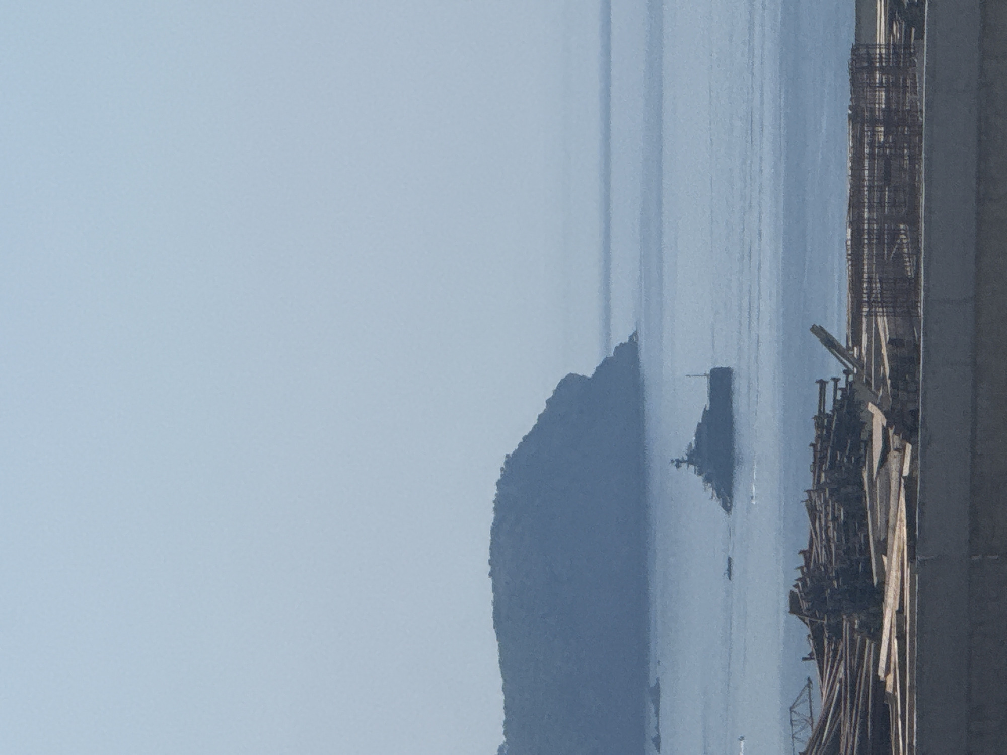 Superyacht anchored off Montenegro coast, viewed from construction site