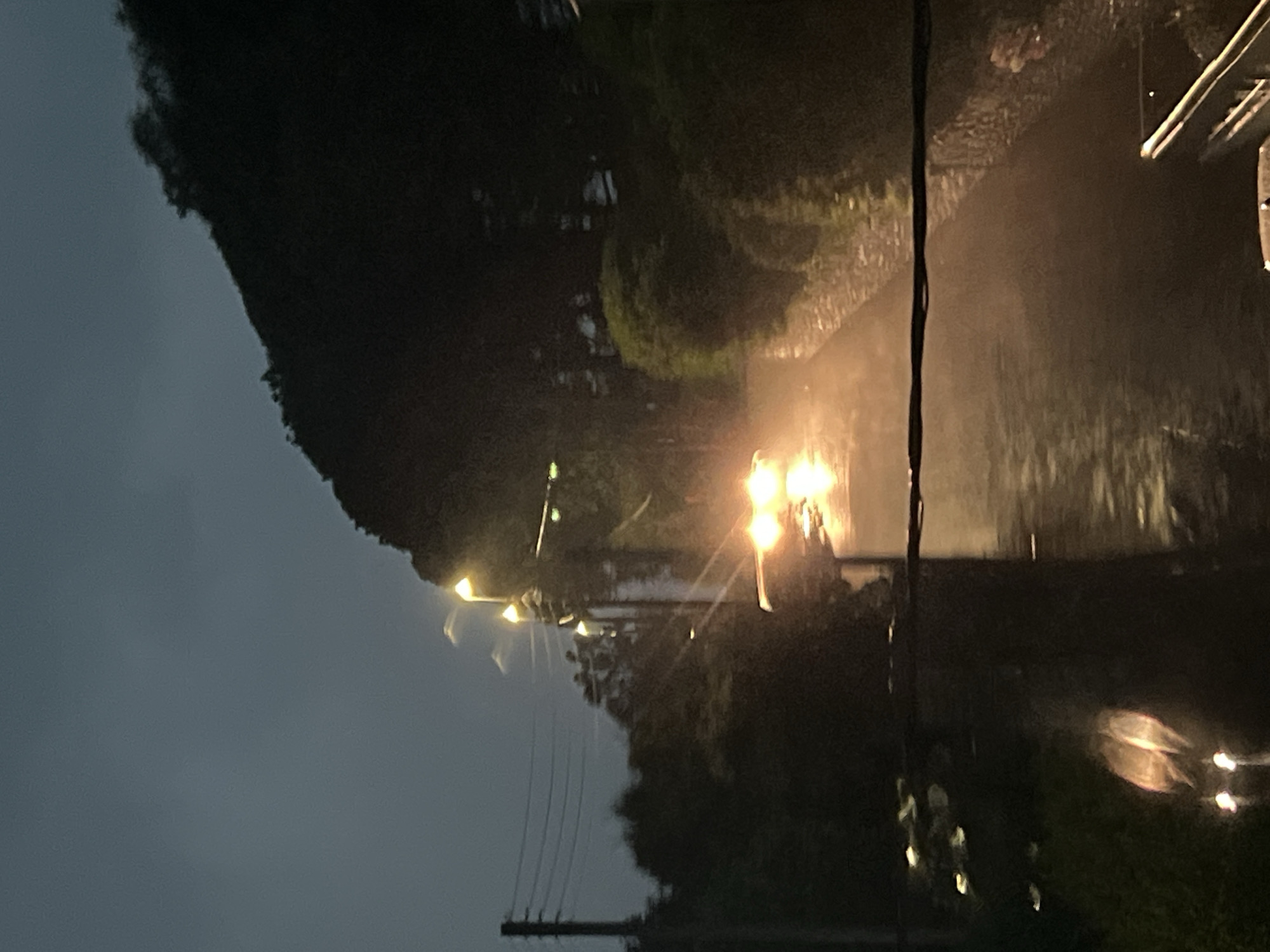 Wet streets and dusk light in a rainy Mountcharles evening