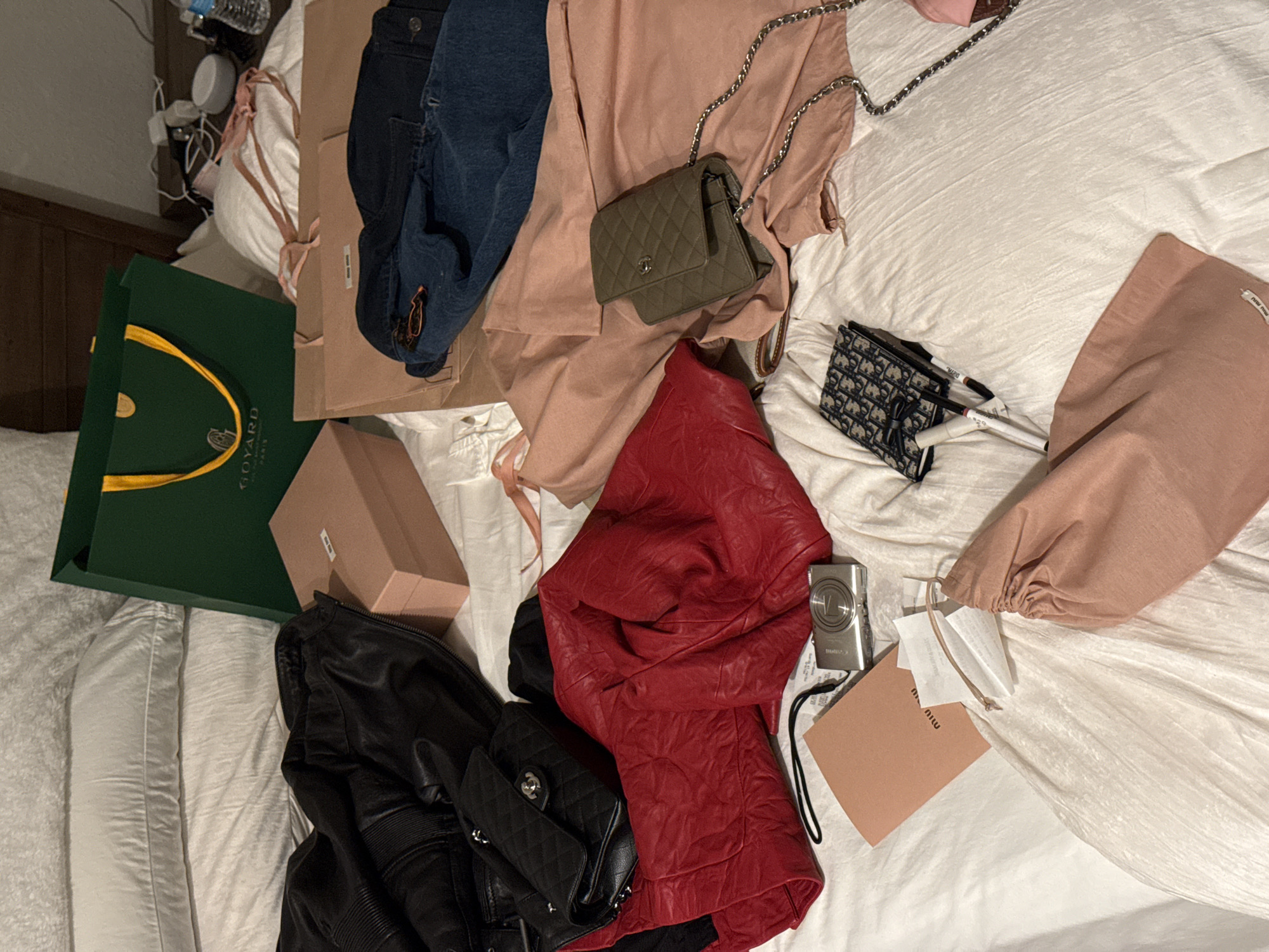 Luxury fashion items found scattered on bed in Chula Vista