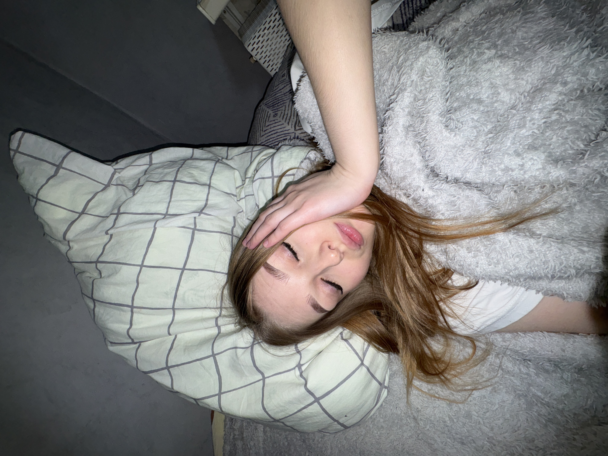 Woman resting in bedroom captured in Chaikovsky, Russia