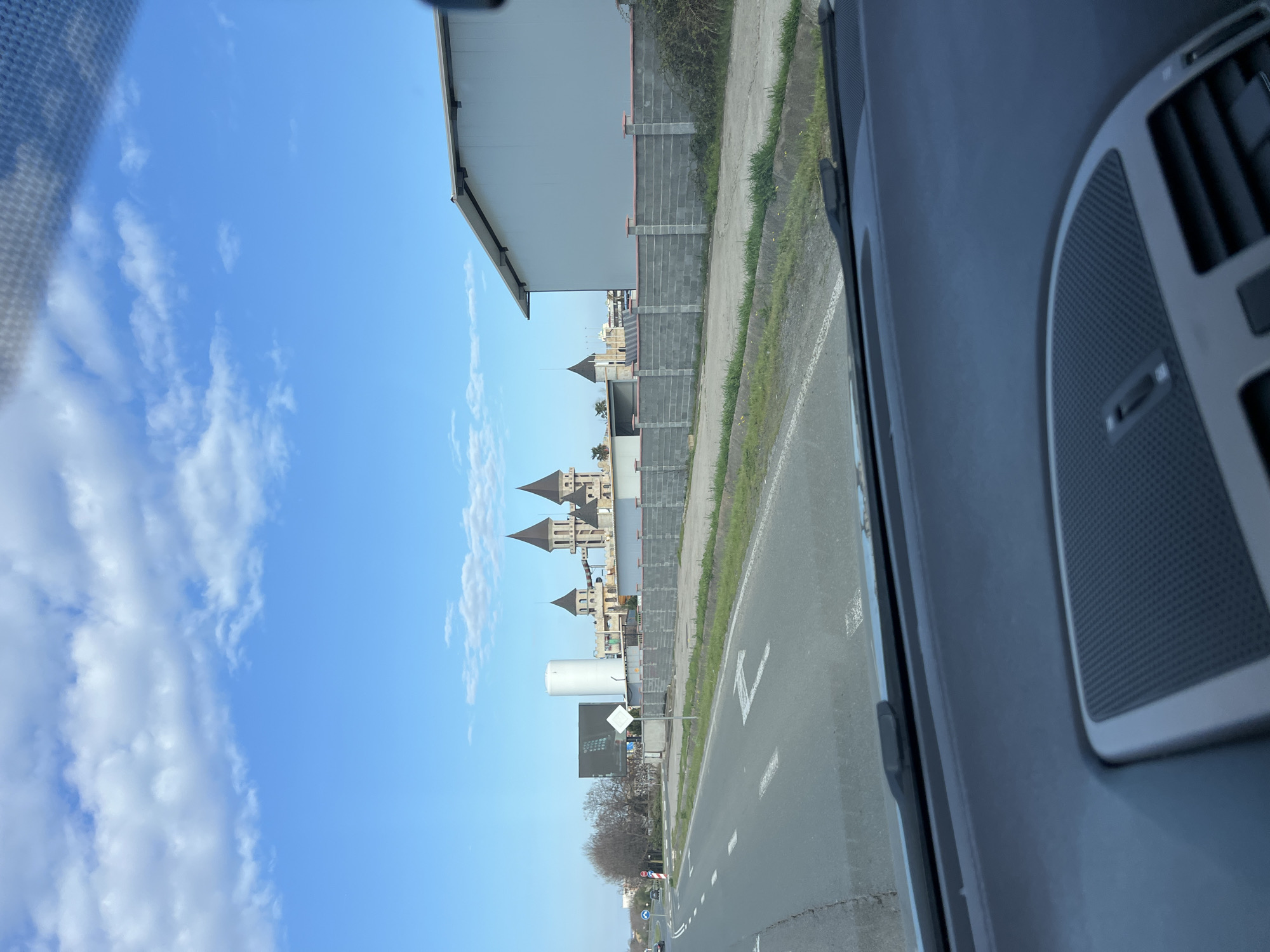 Vehicle passes castle-themed architecture in Ravda, Bulgaria