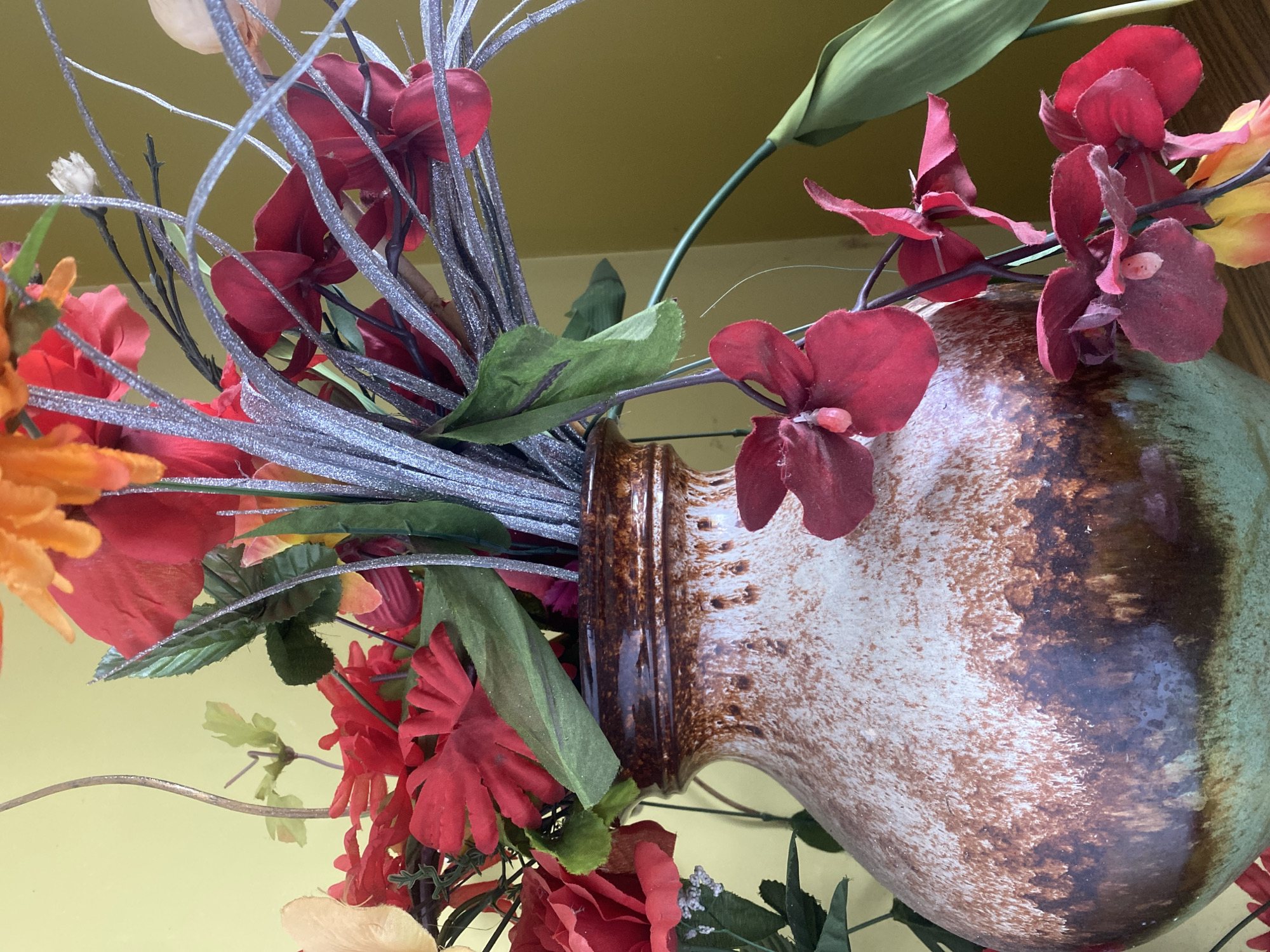Indoor still lifes, decorative objects, and a parked Mustang outside
