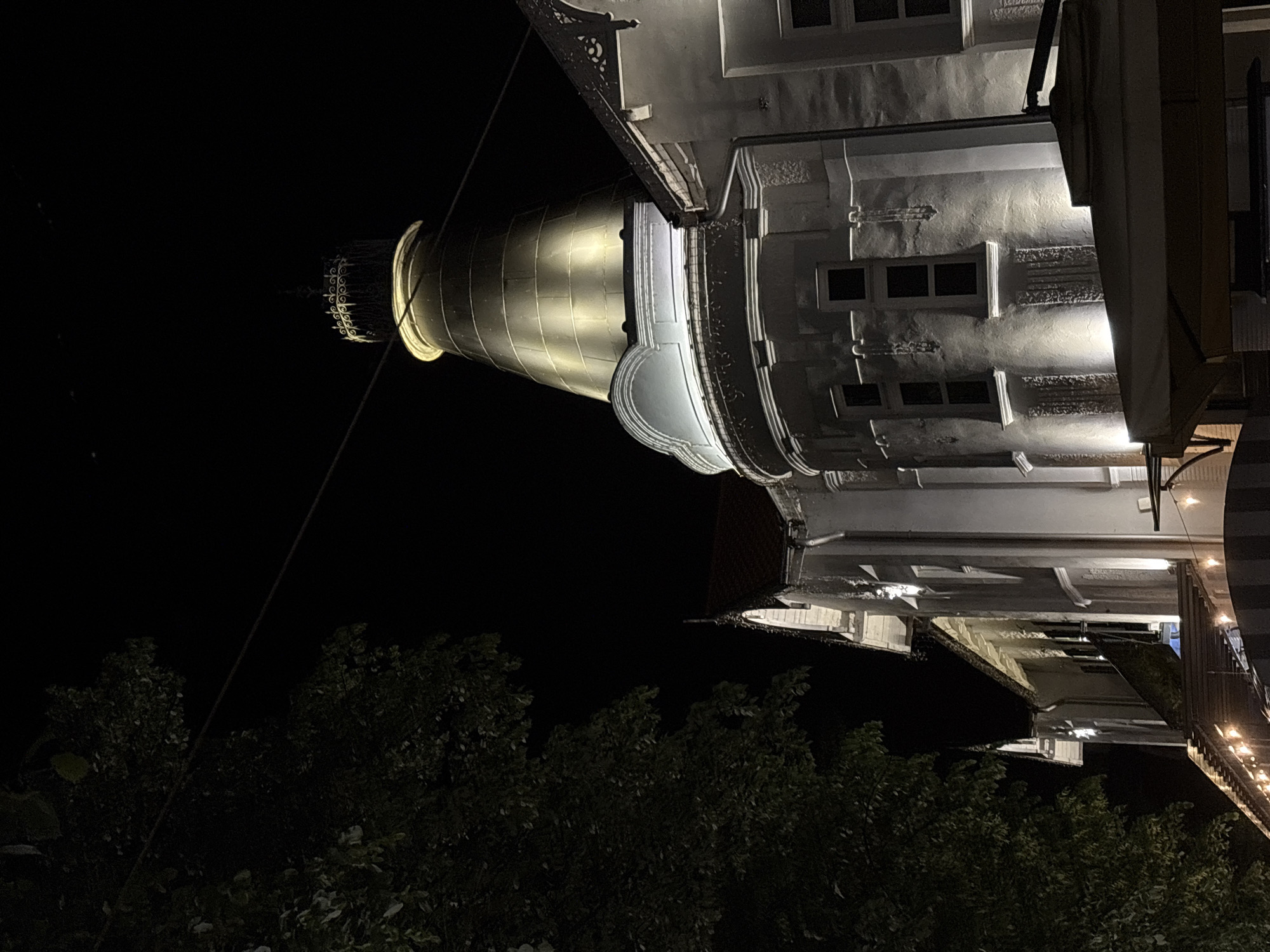 Illuminated baroque church photographed at night in Serbian municipality