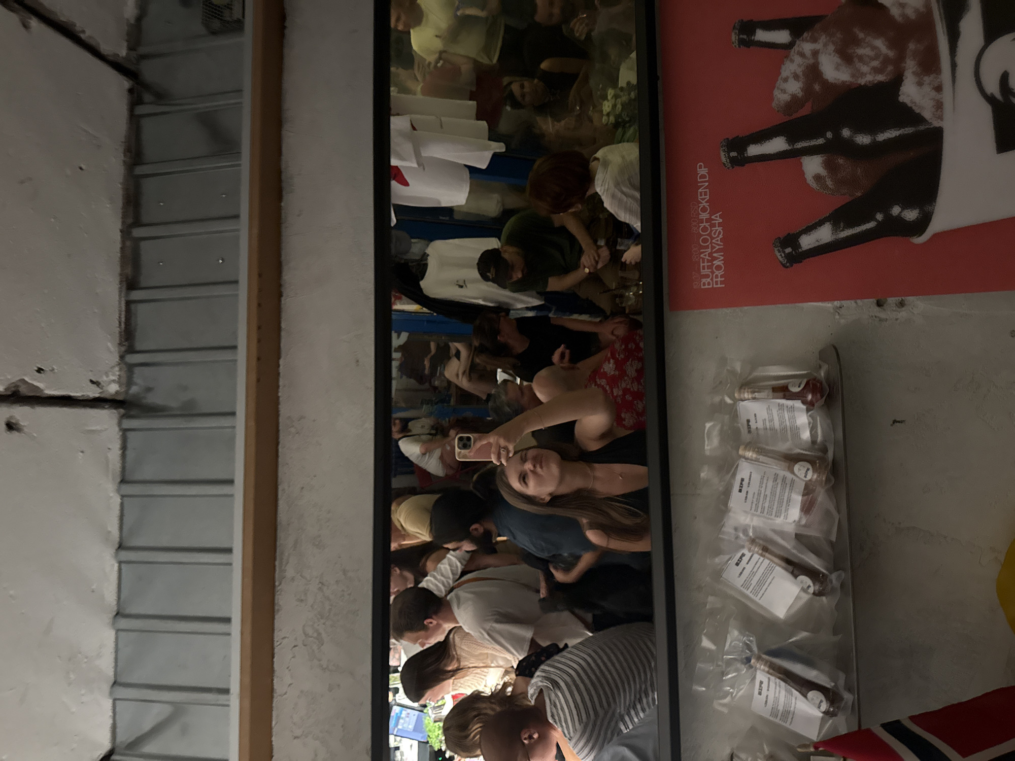 Mirror selfie moment inside a busy Belgrade bar