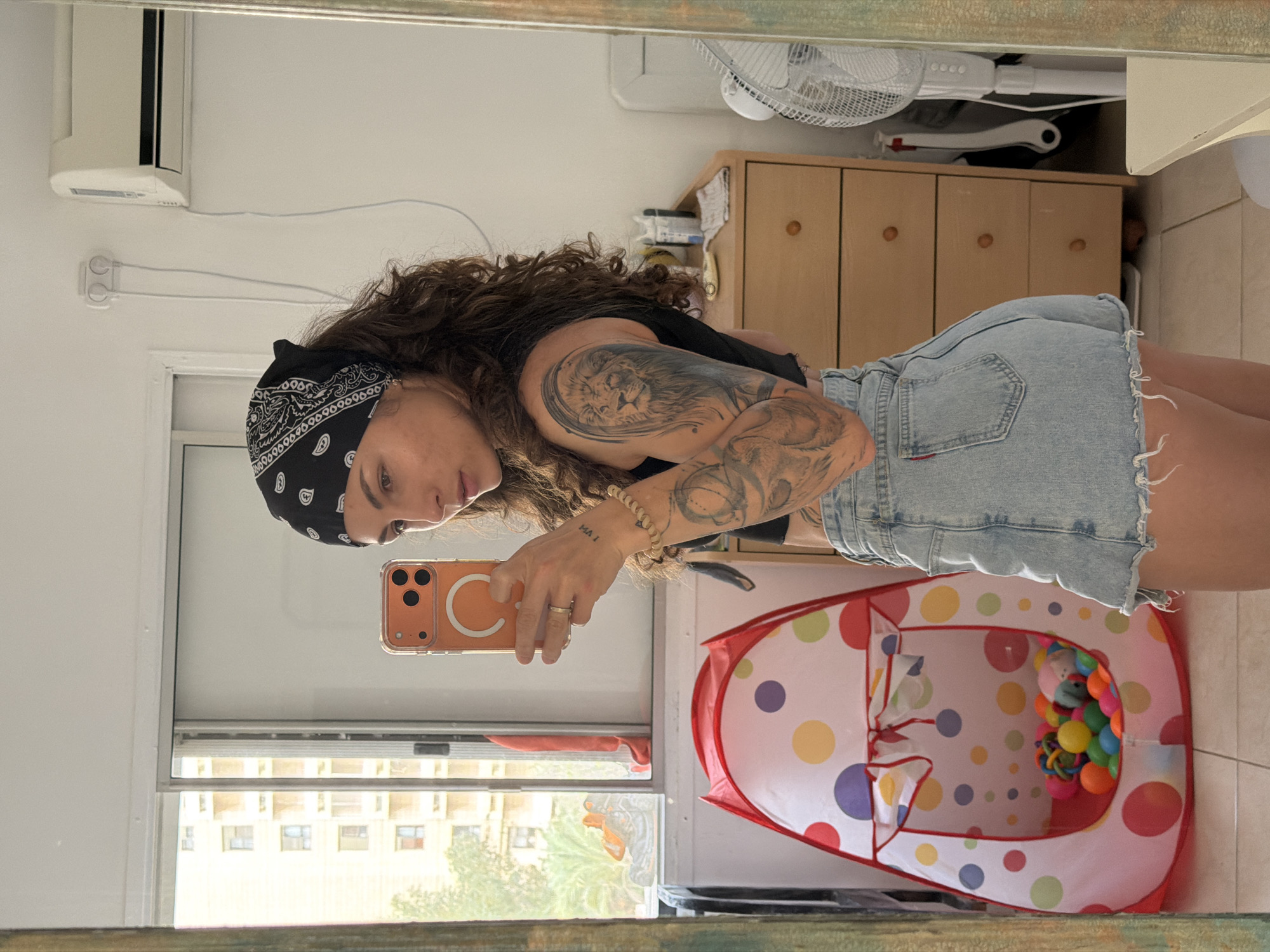 Woman takes mirror selfies in Kiryat Bialik residence