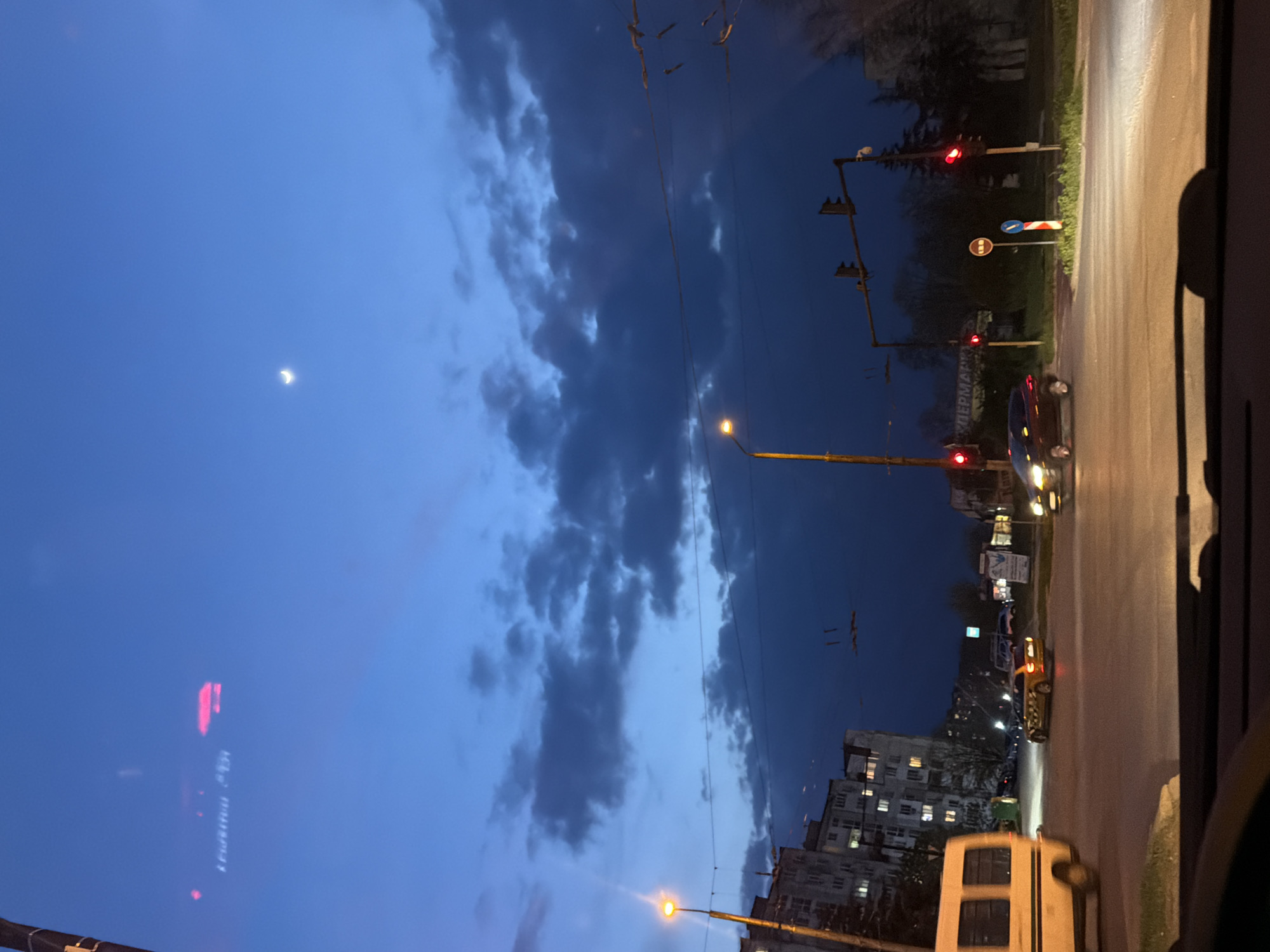 Dusk street scene observed from vehicle in Varna, Bulgaria