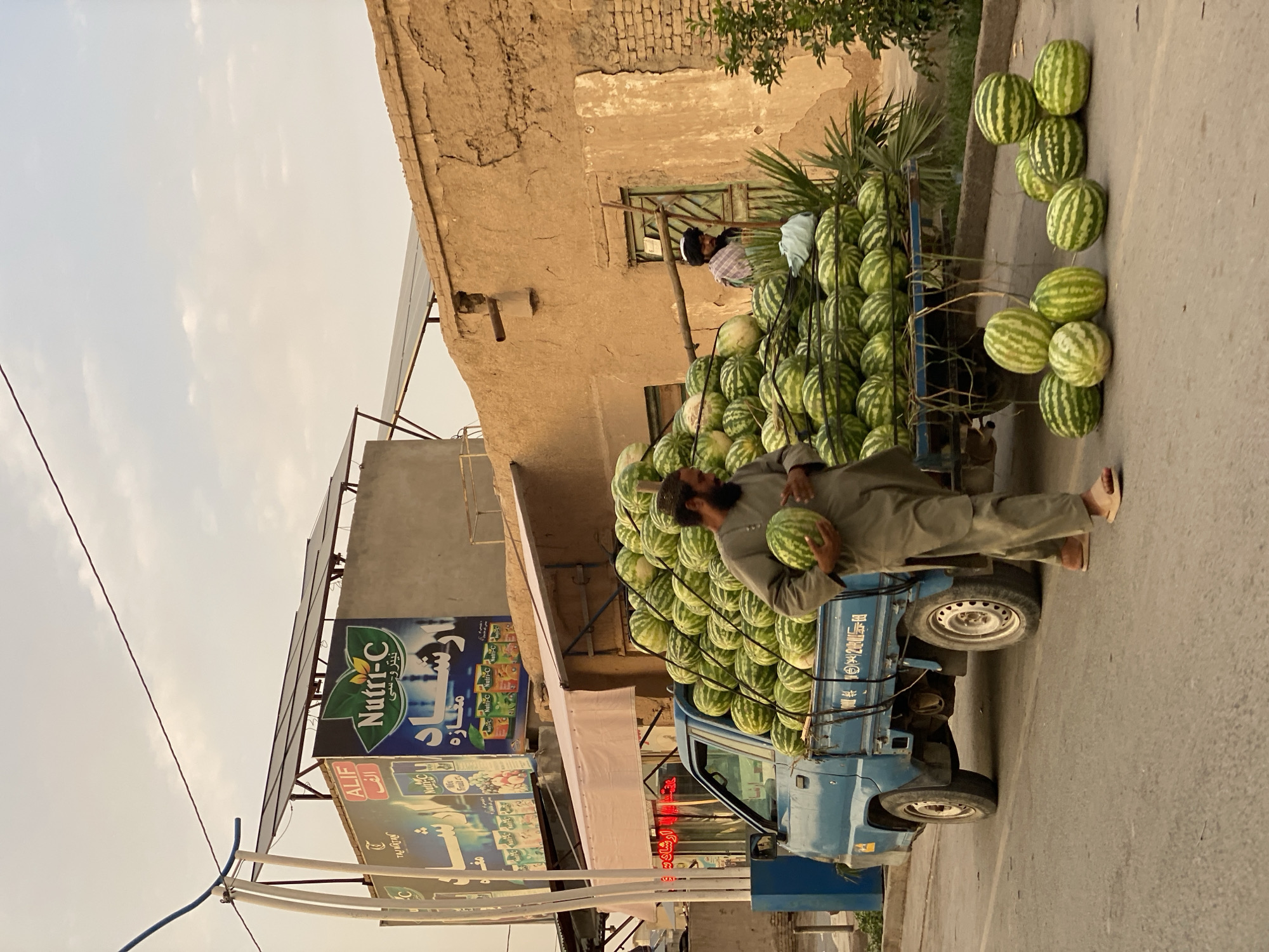 Watermelon vendor on a busy Kandahar street