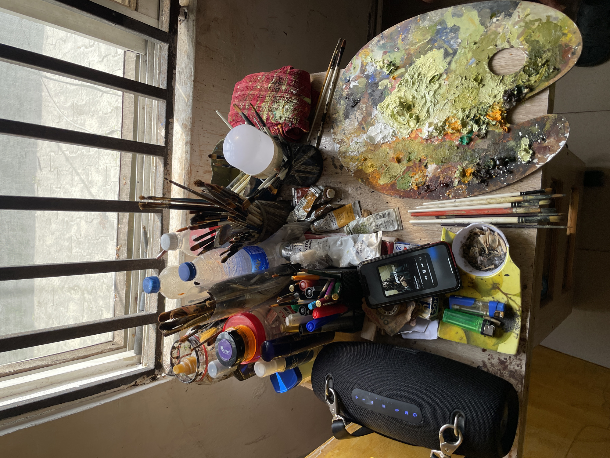 Artist at work on a large traditional portrait in Ado, Nigeria